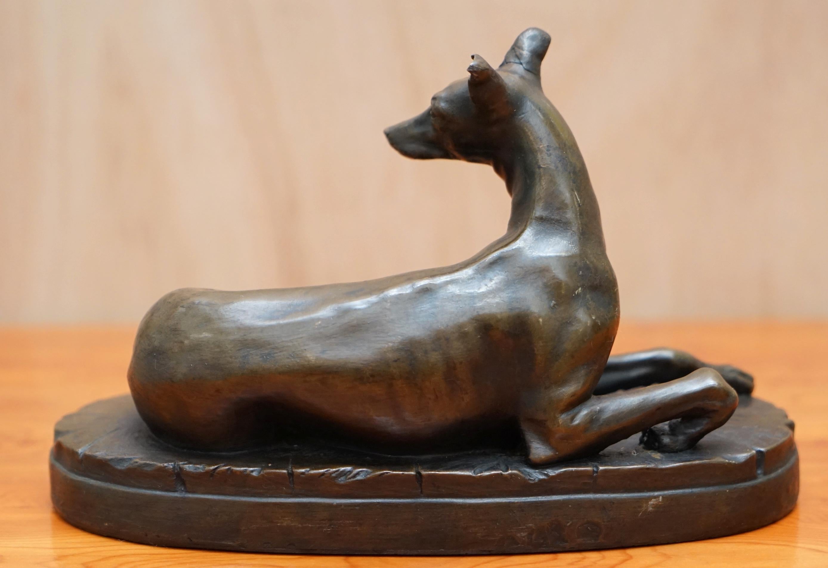 Lovely Bronze Statue of a Whippet Dog Laying Down with a Expecting Expression 1