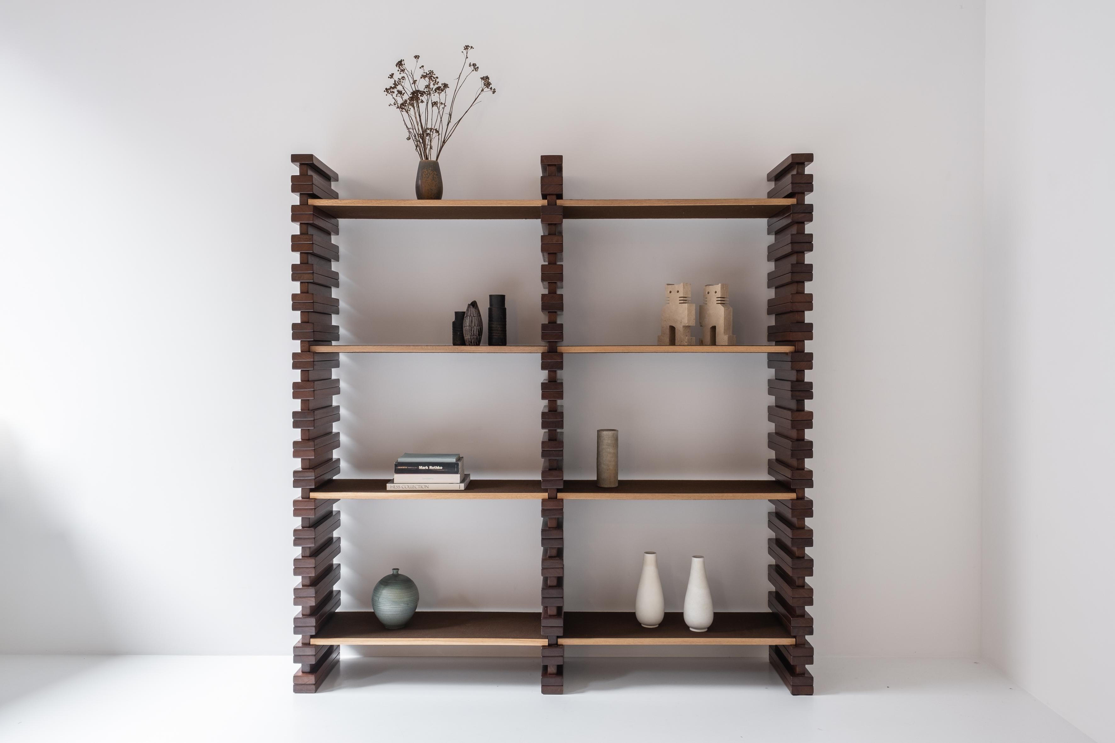 Lovely brutalist open bookshelf from the 1960s. This cabinet features three vertical elements in stained oak with several adjustable shelves. Also included are three extra elements to make the shelf even higher (shown on the last picture). Designer