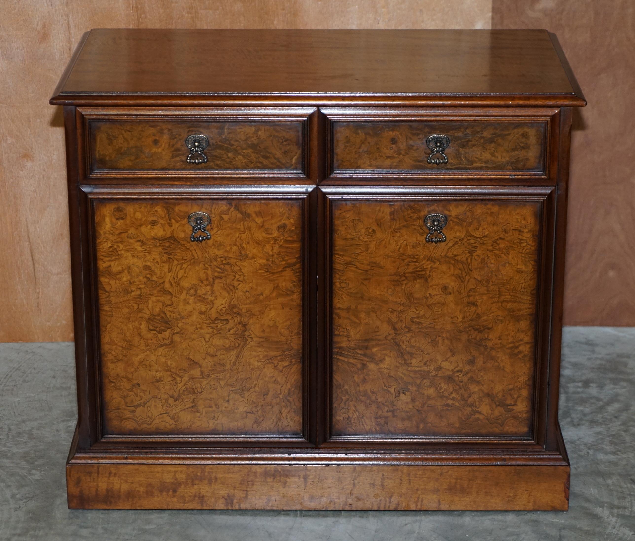 We are delighted to offer for sale this lovely twin drawer Burr & Quarter cut walnut sideboard

A good looking and well made piece which is very utilitarian, it can be used as a media cupboard, office storage or as a kitchen wears as it was