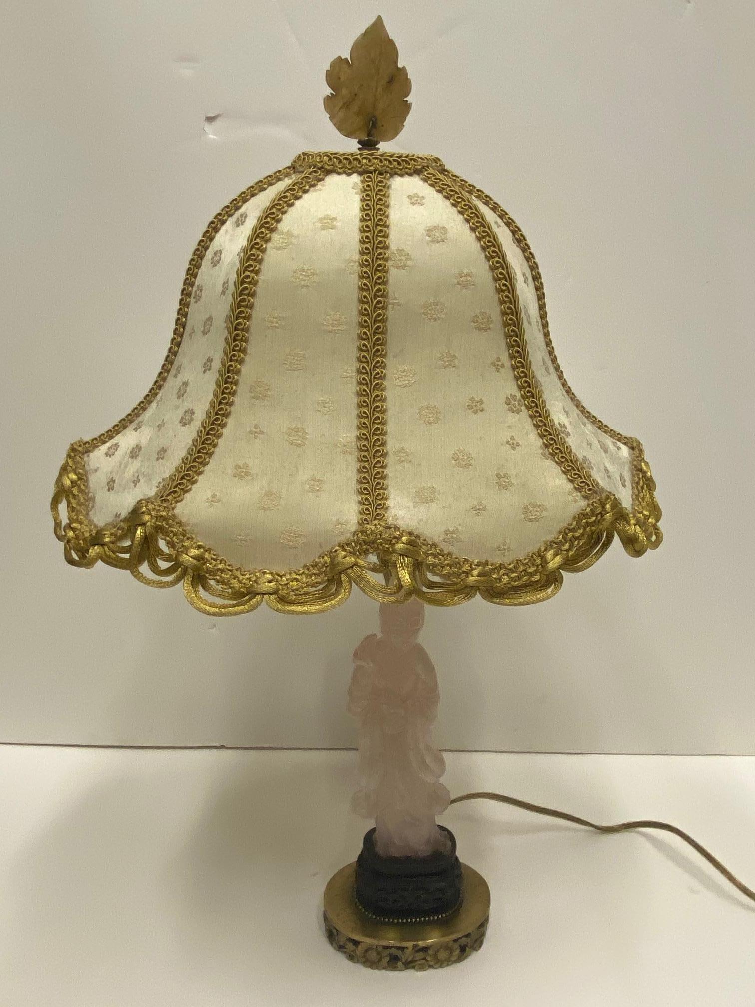 Romantic Chinese figural quartz lamp with lovely custom shade and brass base.
Measures: Lamp itself is 21 H, 4.5 W, 2.5 D.