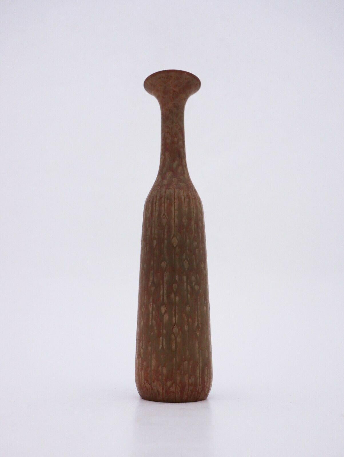 A vase with a lovely speckled glaze designed by Gunnar Nylund at Rörstrand. It is 25.5 cm high and in very good condition except from some minor marks in the glaze why it is marked as 2nd quality. 

 
