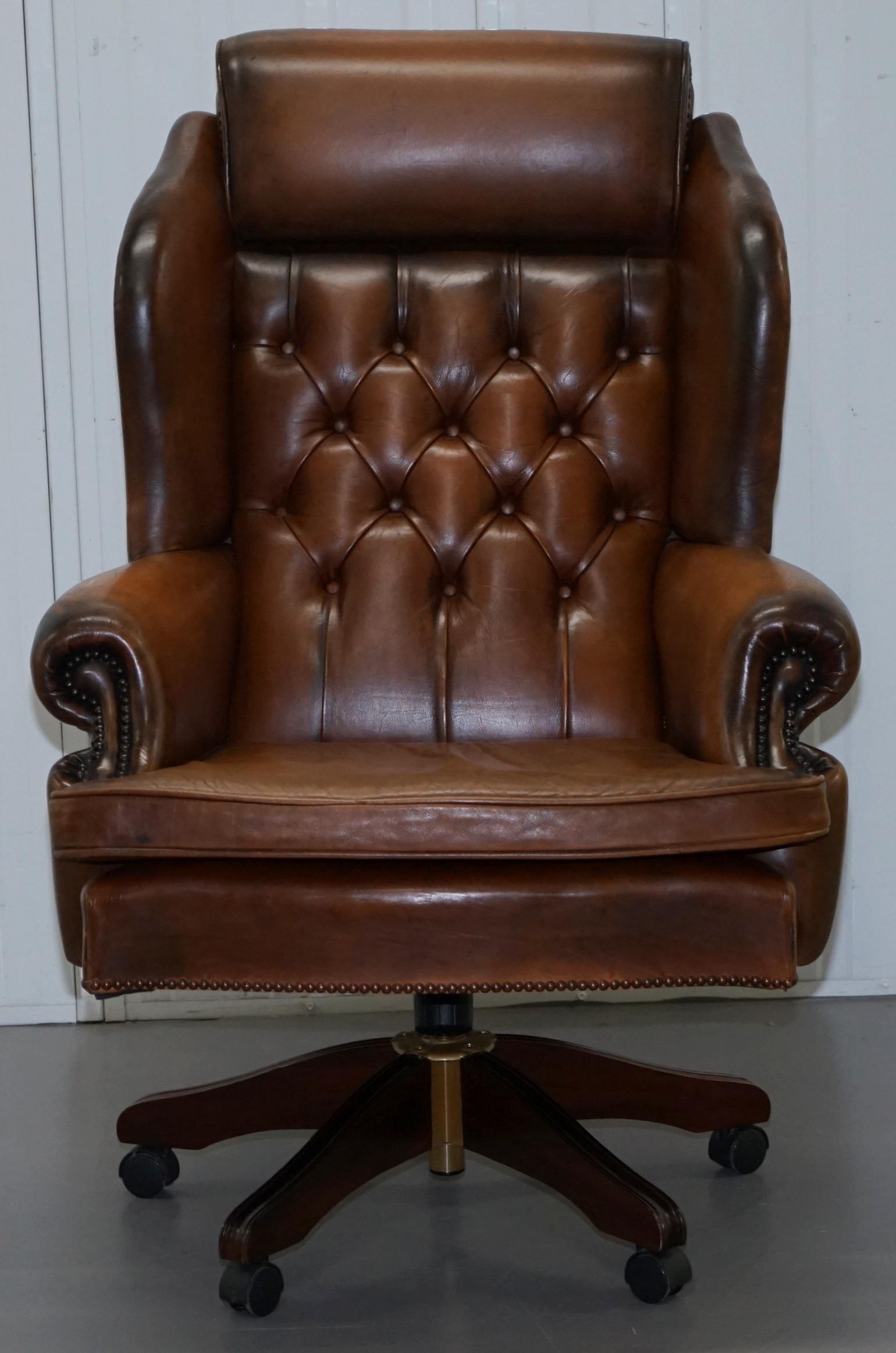 We are delighted to offer for this absolutely stunning hand dyed aged brown leather Chesterfield Presidents captains chair

This chair is the big daddy, the bosses chair hence being named “The President!” It is as comfortable as your favourite