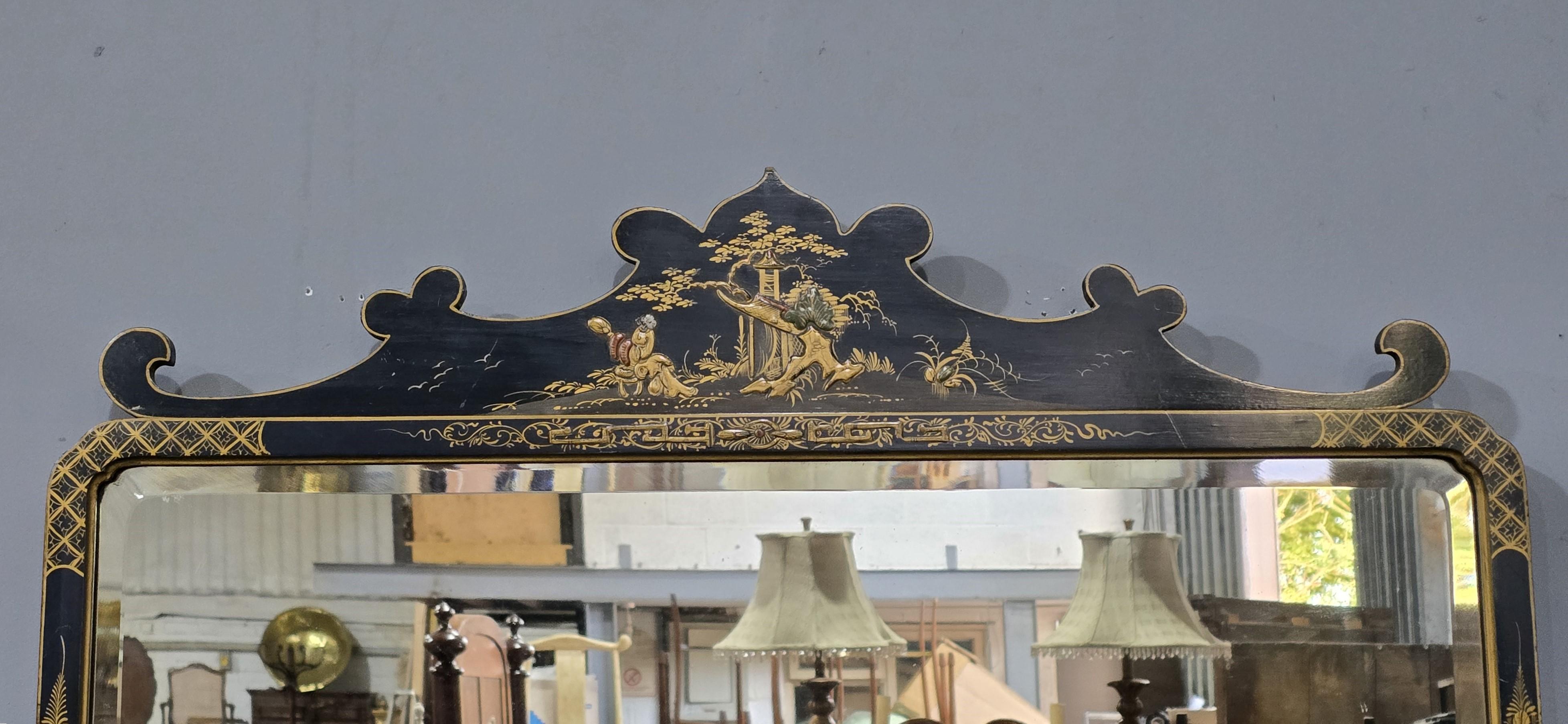 A very good quality black chinoiserie wall mirror with original bevelled plate, in overall very good original condition, having only slight misting to the glass.

27.5