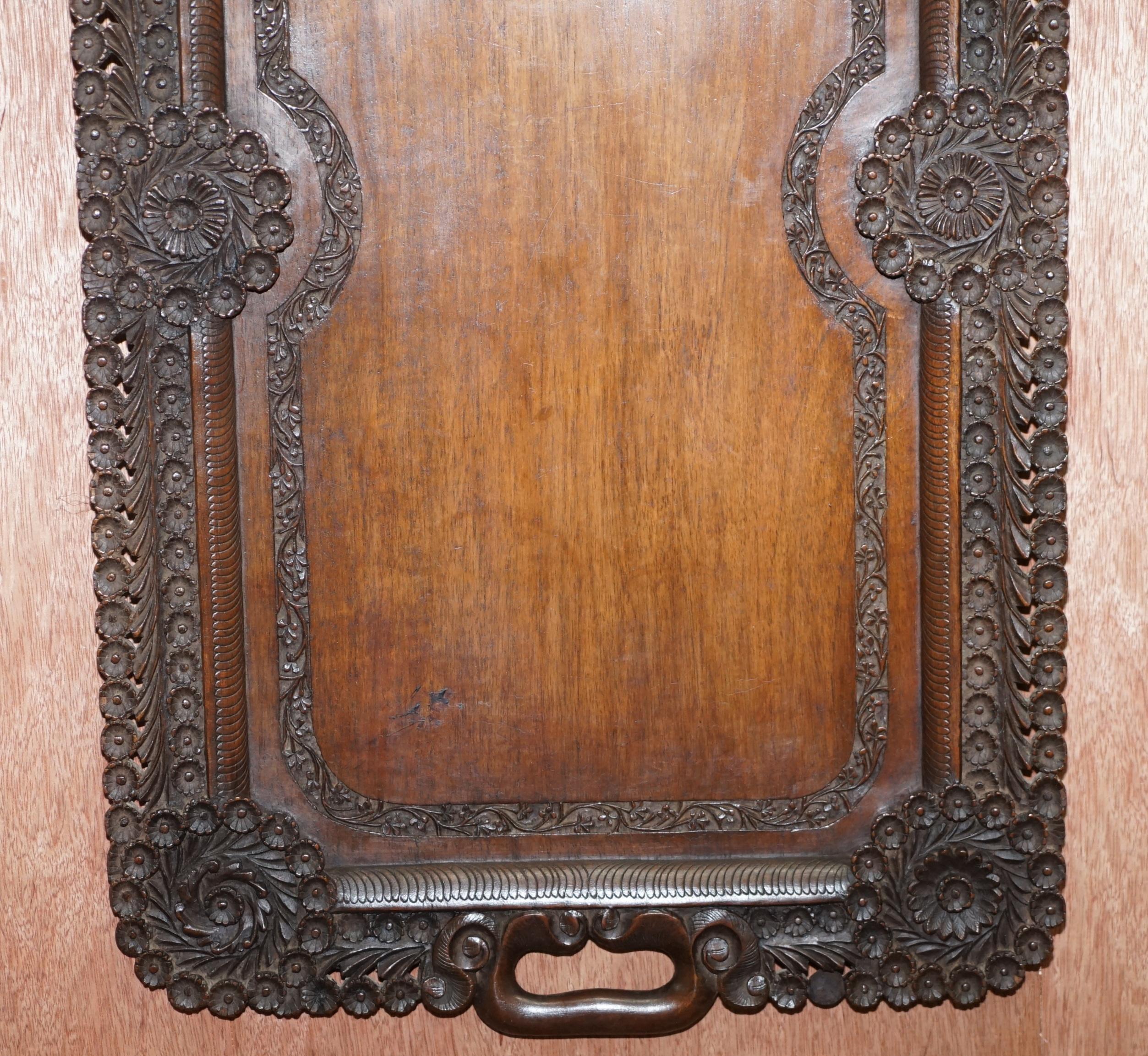 We are delighted to offer for sale this very rare circa 1900 Anglo-Indian hand carved from a single piece of timber serving tray

A very good looking and exquisitely carved piece, the piece is in Mahogany and is floral carved all over 

We have