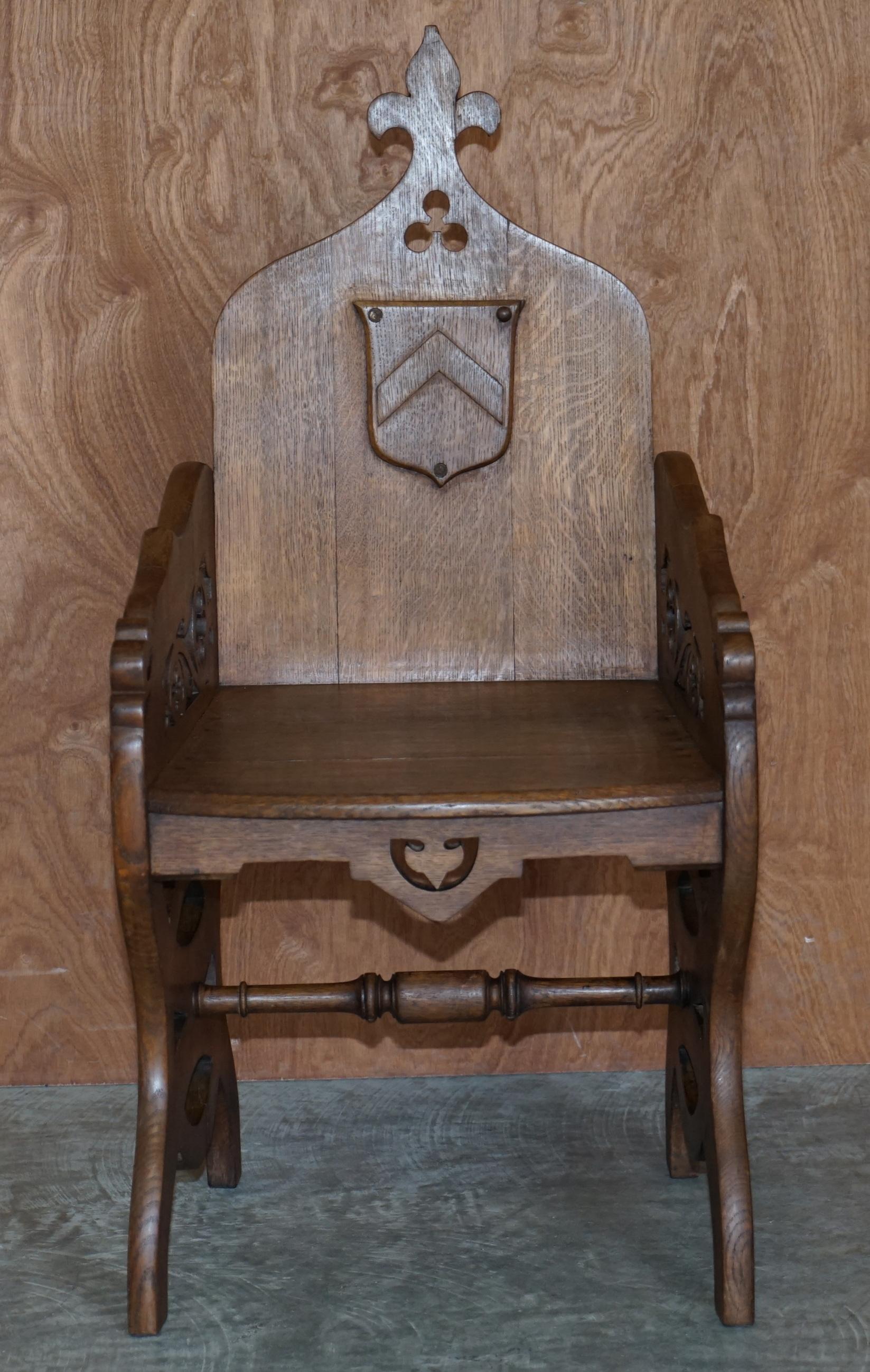 We are delighted to offer this lovely antique Gothic revival circa 1900 English oak steeple back armchair

A good looking and well made oak table, it has the period timber patina, the back has a small coat of arms plaque, it also has an original
