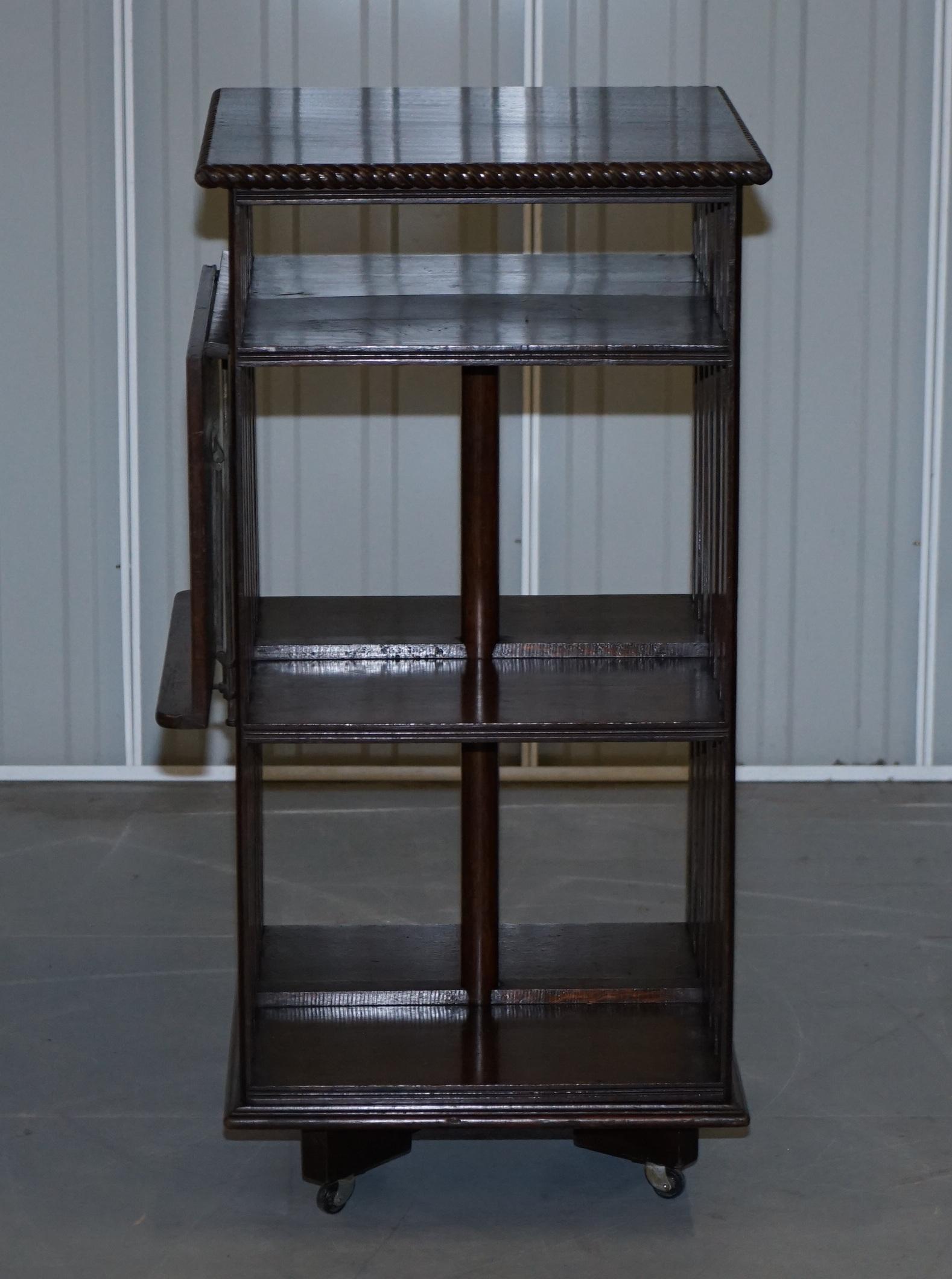 We are delighted to offer for sale this stunning circa 1900 oak revolving bookcase with lift up desk or book sorting table 

An exceptionally well made and decorative library bookcase. Its rare to find them with the table for sorting the books, I