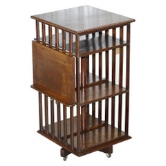 Lovely circa 1900 Edwardian Solid Oak Revolving Bookcase with Lift Up Desk Piece