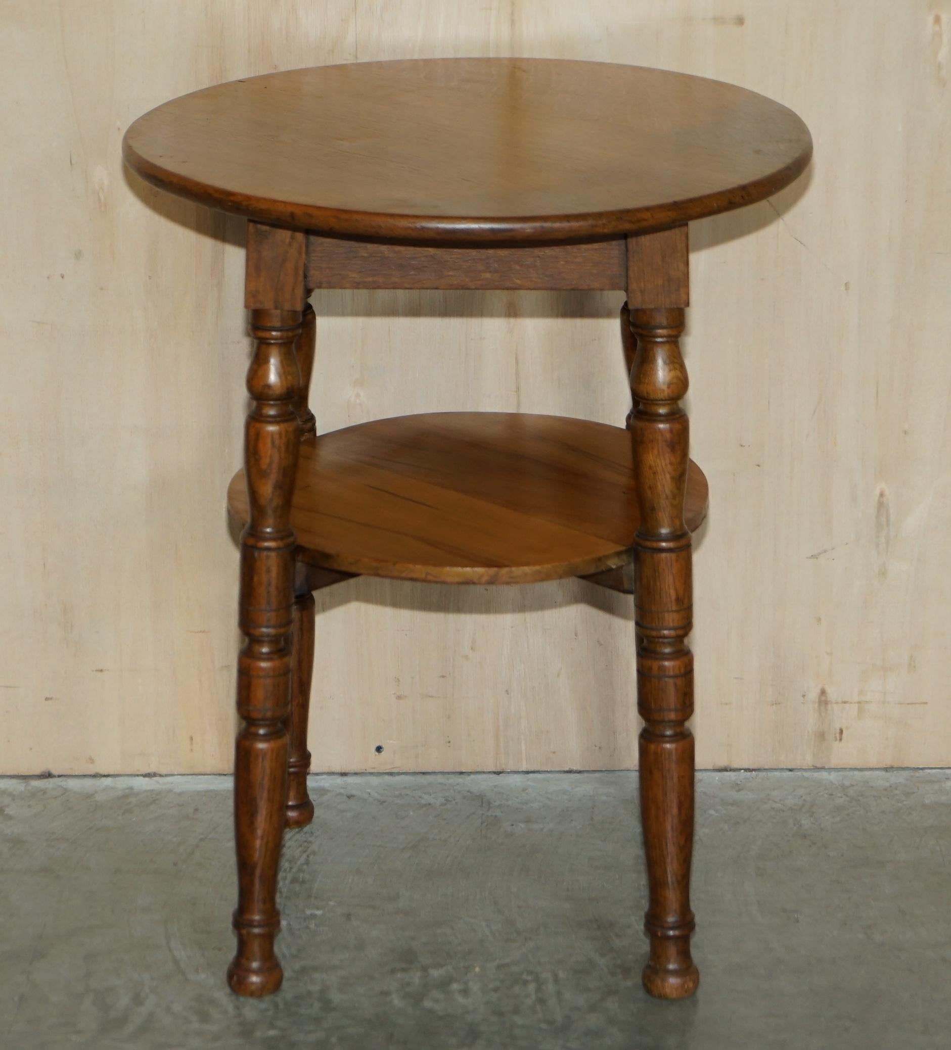 We are delighted to offer for sale this lovely circa 1900 English oak round side table with turned legs

A very good looking well made and decorative piece, the legs are nicely turned, it is a two tier table so you can place a small plant or
