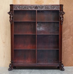 Lovely circa 1900 Hand Carved Library Bookcase in Hardwood with Herm Statues