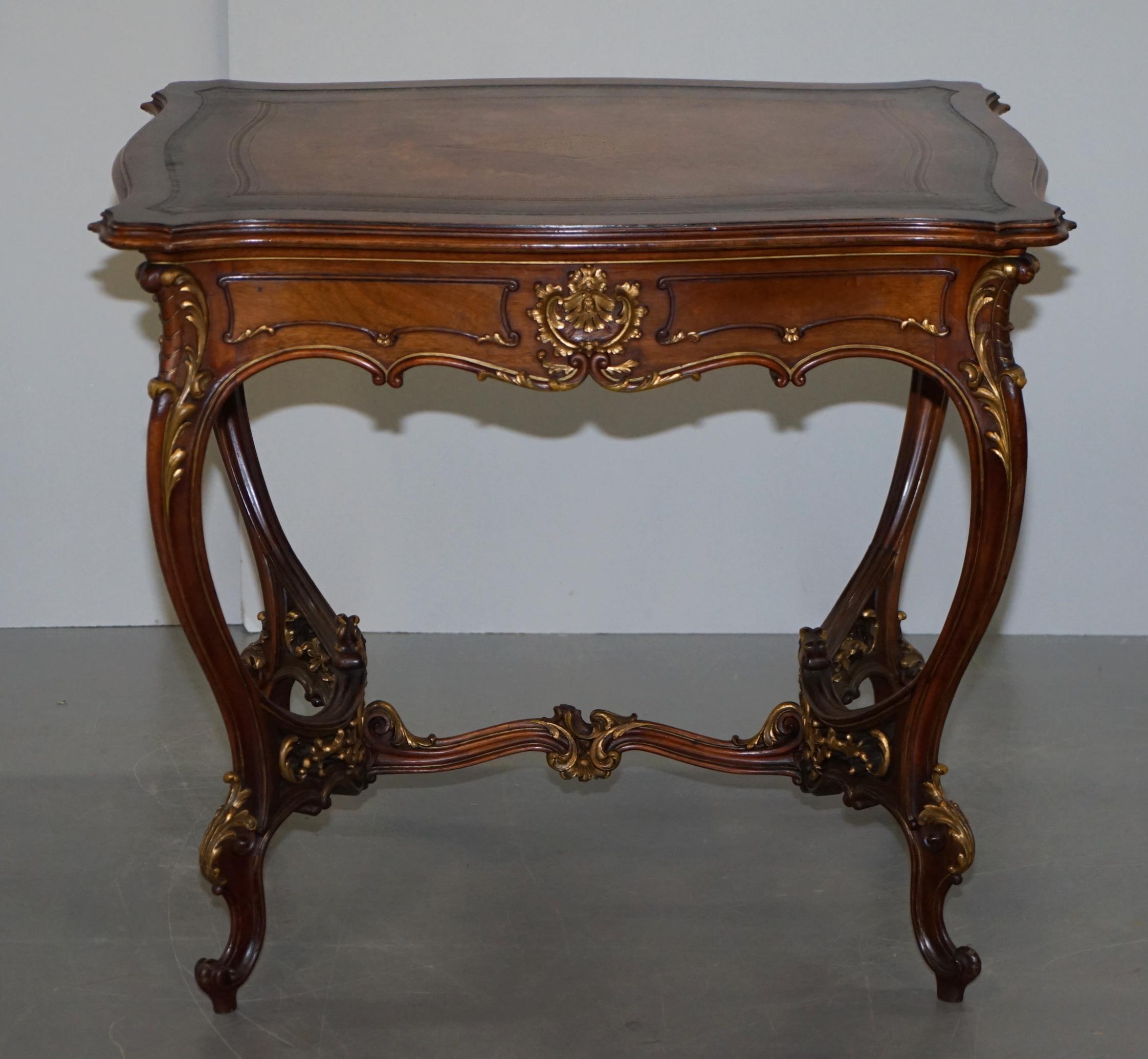 We are delighted to offer for sale this lovely antique French circa 1900 late Victorian pine writing table, desk or occasional centre table with brown leather top and giltwood frame

A very decorative and versatile piece, it looks to have been