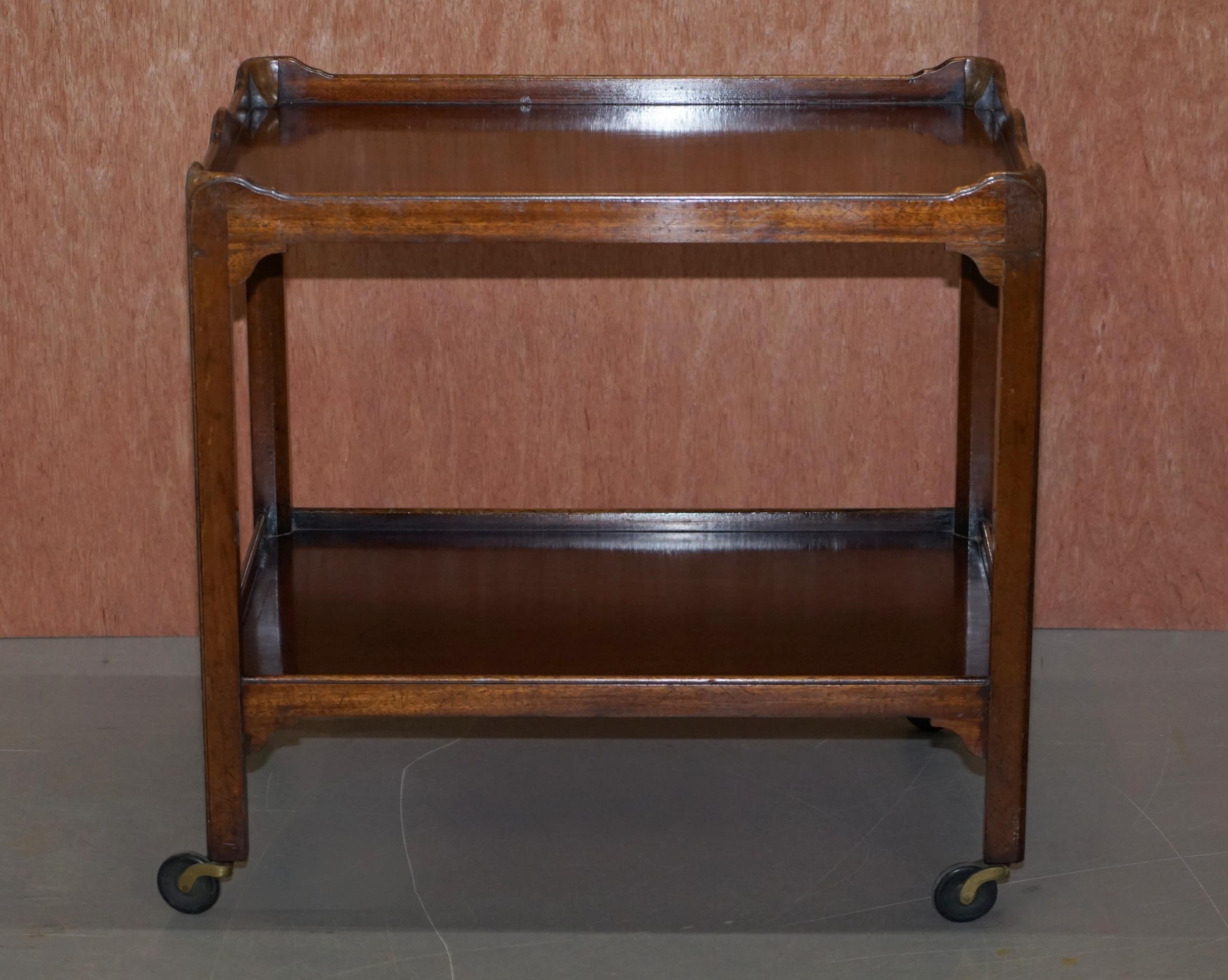 We are delighted to this lovely circa 1900 walnut drinks tea trolley

A very good looking and well-made tea trolley, bronze mounted feet, fully functional, we have cleaned waxed and polished it and its in ready to go condition