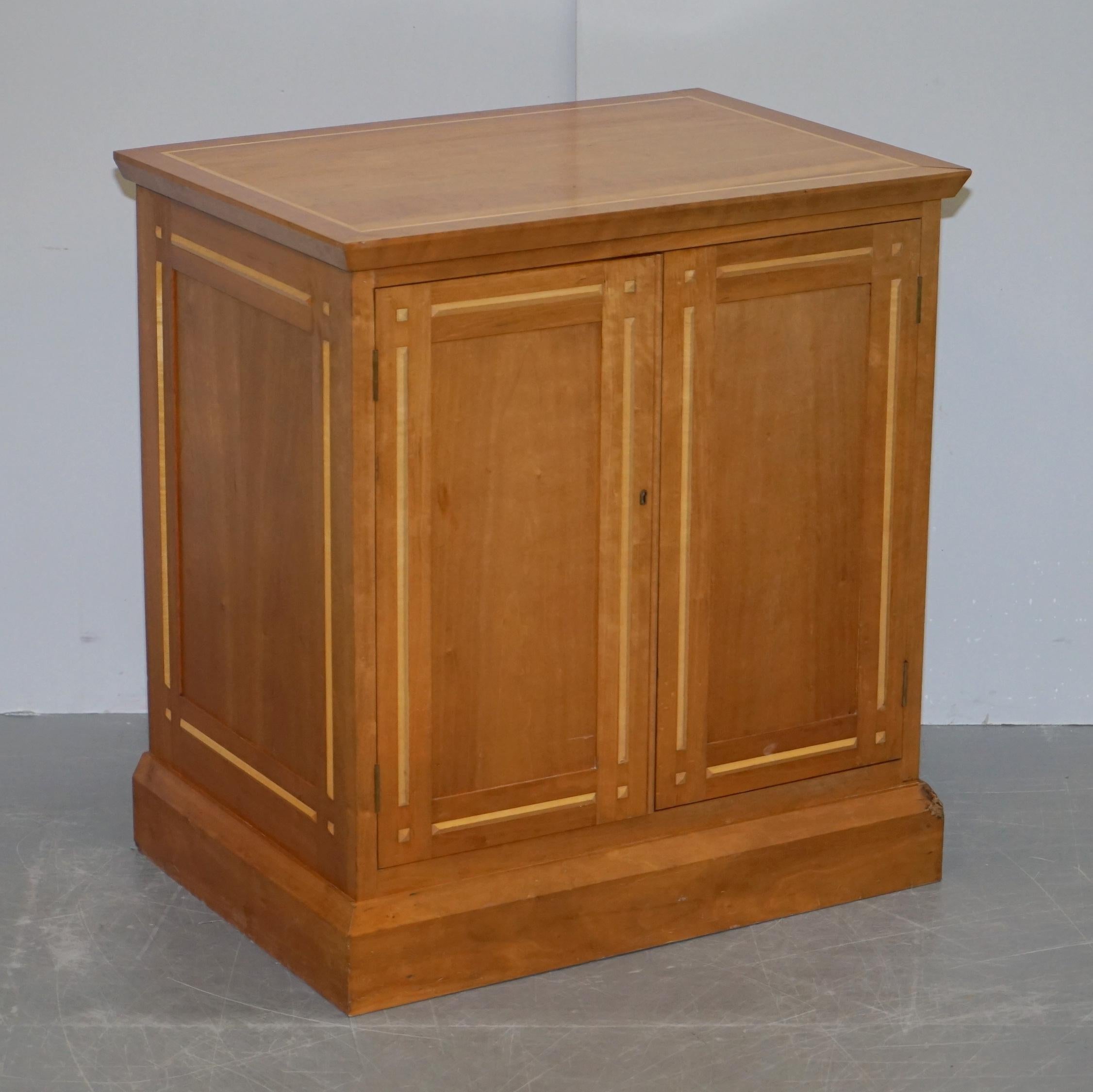 We are delighted to this stunning Satinwood and Walnut cupboard with sliding linen shelves attributed to David Linley

An exquisite looking and very well made piece. This was sold to me as David Linley however I can’t see the paper label on the