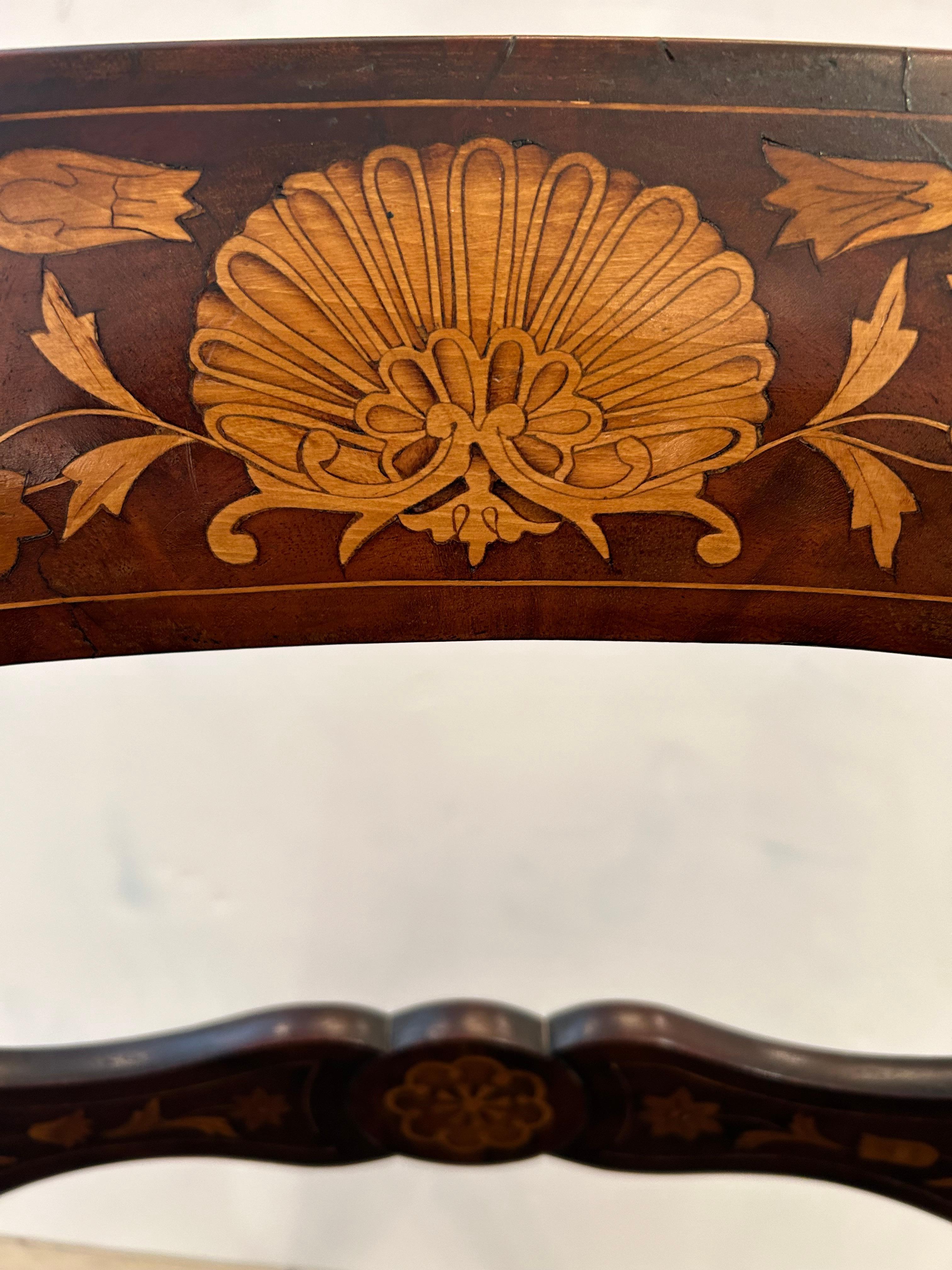 Classic Dutch marquetry armchair having scrolled arms, tapered legs and gorgeous satinwood inlay.  Seat is green velvet.