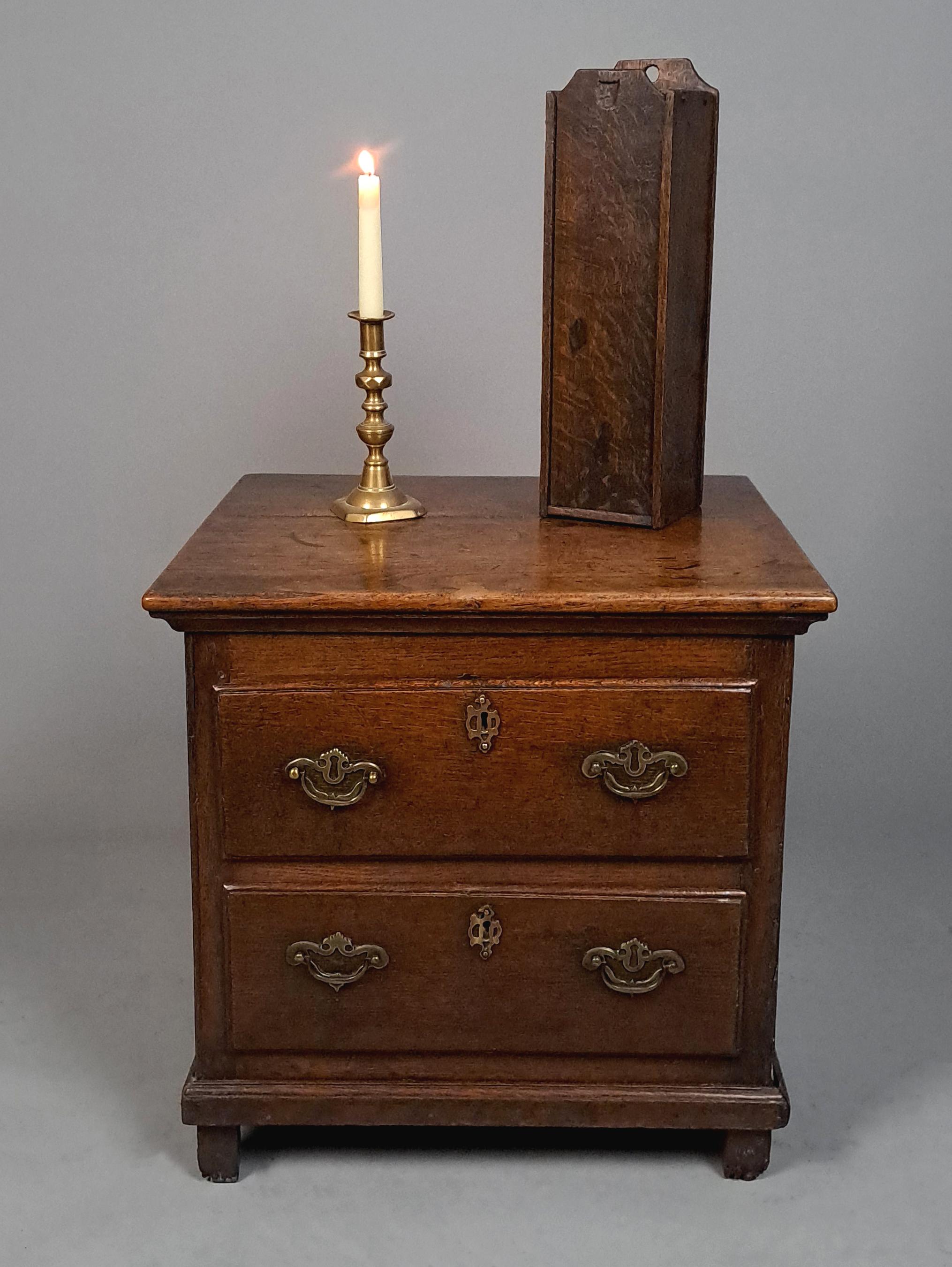 In the days before electricity every room in the house would be lit by candles and each room would have a wall hung box or cupboard in which to keep them away from vermin.

This box is made in oak, hand adzed to all surfaces and with a lovely colour