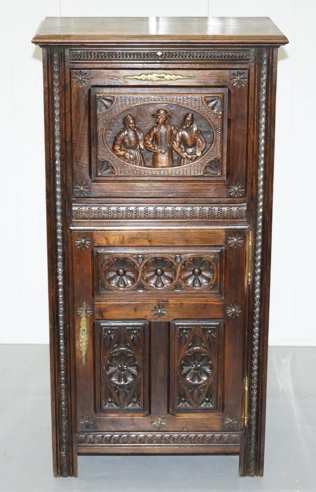 We are delighted to offer for sale this stunning hand-carved Dutch cabinet depicting rural scenes from the very early 19th century.

A very good looking and well-made piece depicting a rural scene from Holland

The unit is tall boy size, it