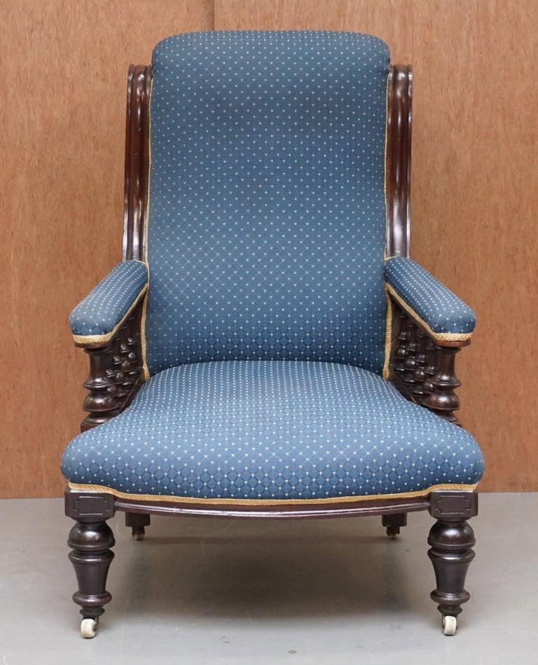 We are delighted to offer for sale this lovely early Victorian mahogany carved library reading armchair which is part of a suite

This chair is very well made, it has a nicely carved solid mahogany frame which has porcelain castors and regency