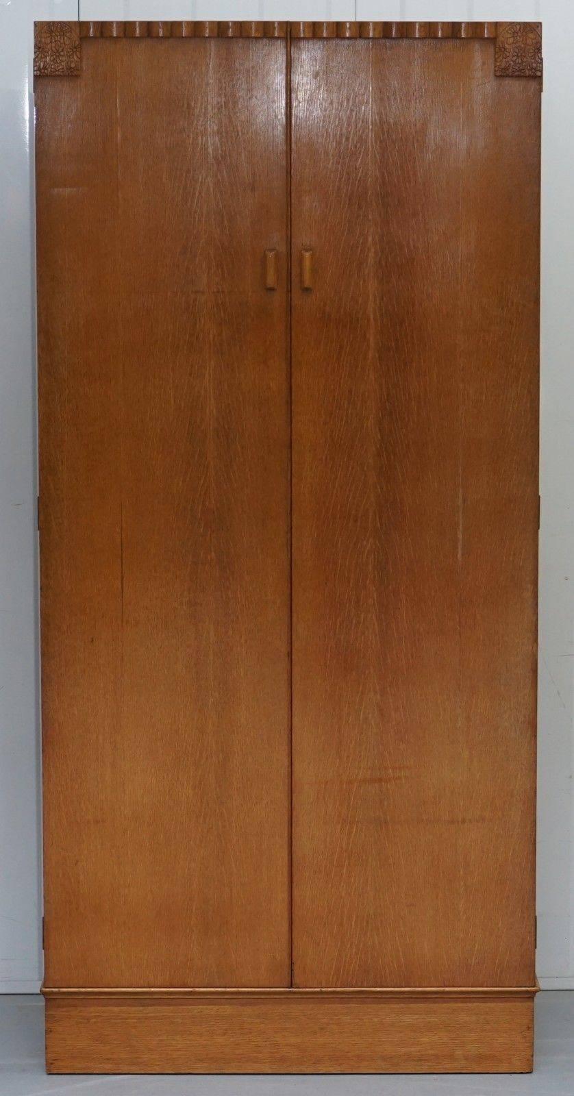 We are delighted to offer for sale this lovely handmade in England satin oak medium sized compendium wardrobe with floral carved detailing

A very good looking and well-made piece in period condition, there’s lots of space for folded clothing, a