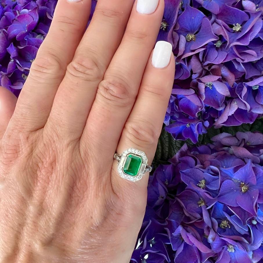It's hard to find an emerald that is both beautiful in color and clean - this platinum emerald ring covers all the bases! Featuring a rectangular-cut emerald weighing 1.27 carats and measuring approximately 8.8 x 6.4 x 3.2mm, bright and lively grass