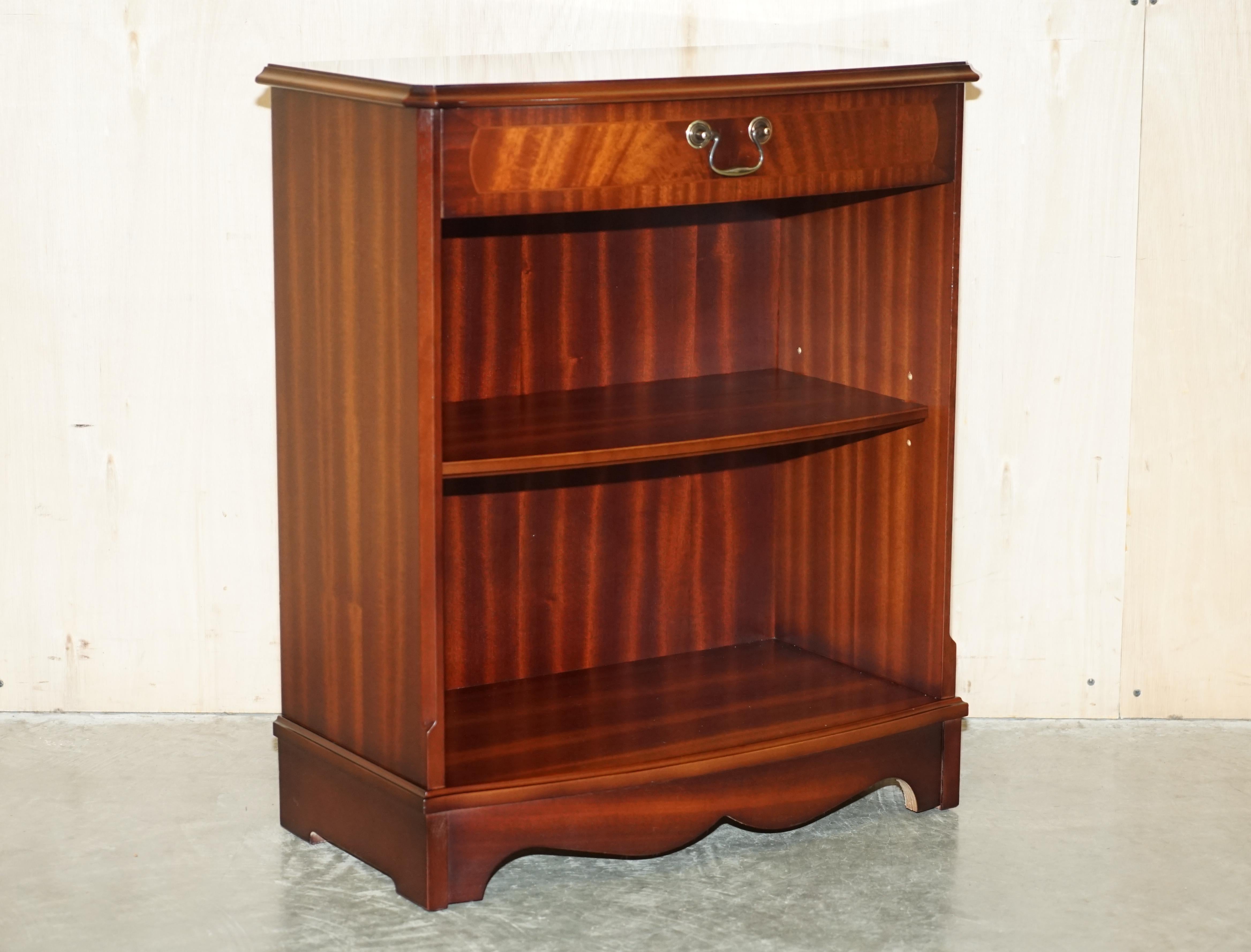 We are delighted to offer for this lovely bow fronted flamed mahogany dwarf open library bookcase with single drawers

A very good looking well made and decorative piece, the shelf is height adjustable and or removable so it can be adjusted to