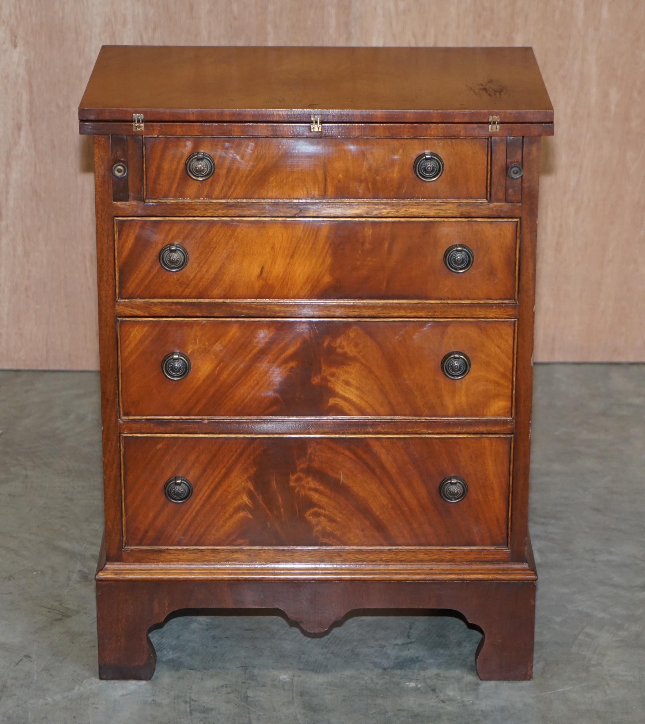 We are delighted to this stunning flamed mahogany bachelor’s chest of drawers with folding butlers shelf

A very good looking well-made and functional piece of furniture. It as for all intents and purposes a Georgian style chest of drawers however
