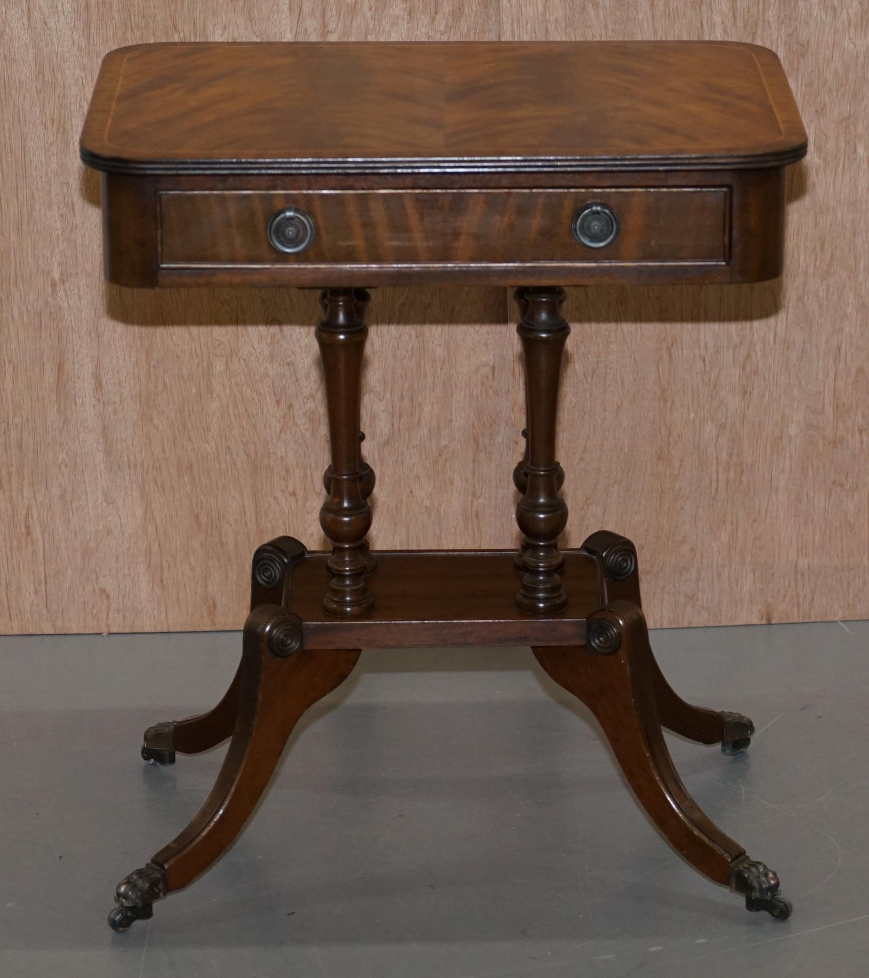 We are delighted to offer for sale this lovely vintage four pillar column base with flamed mahogany top single drawer side table finished with lion hair paw castor feet

A very good looking well made and decorative piece, the timber patina is