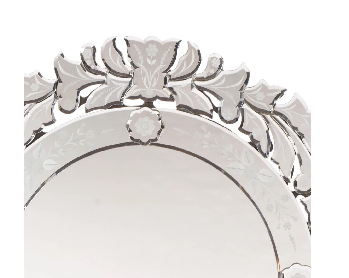 A very lovely Venetian style frameless 
Round mirror with a floral border-
Clear mirror with intricately wide cut-out 
scalloped edges all around with hand etched 
floral decoration, rosettes and floral etched inner 
trim decoration.
20th