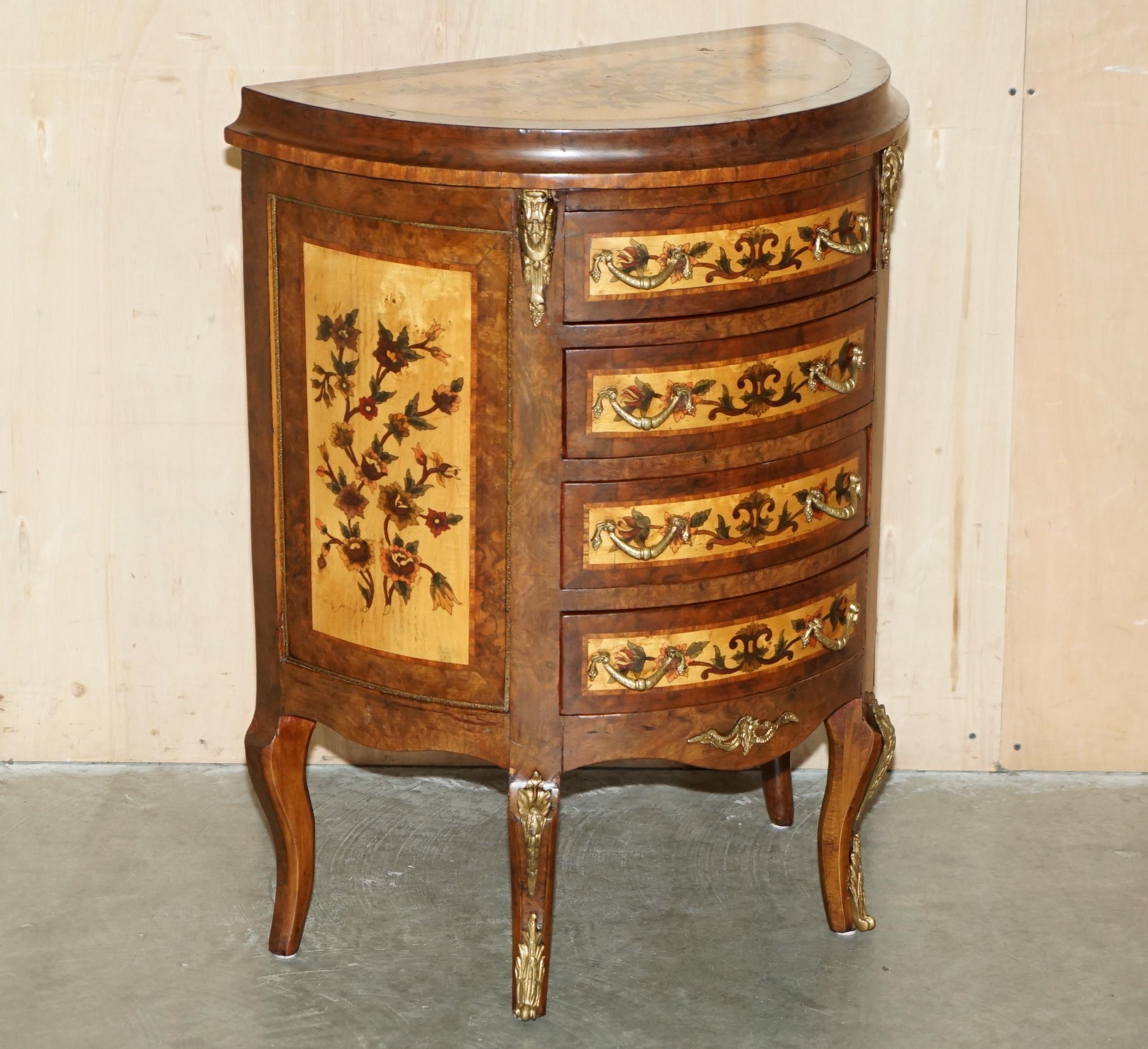 Royal House Antiques

Royal House Antiques is delighted to offer for sale this exquisite French Burr Walnut, Walnut and Satinwood Demi Lune sideboard with four drawers and finished with an ornate Floral painted decorative

Please note the delivery