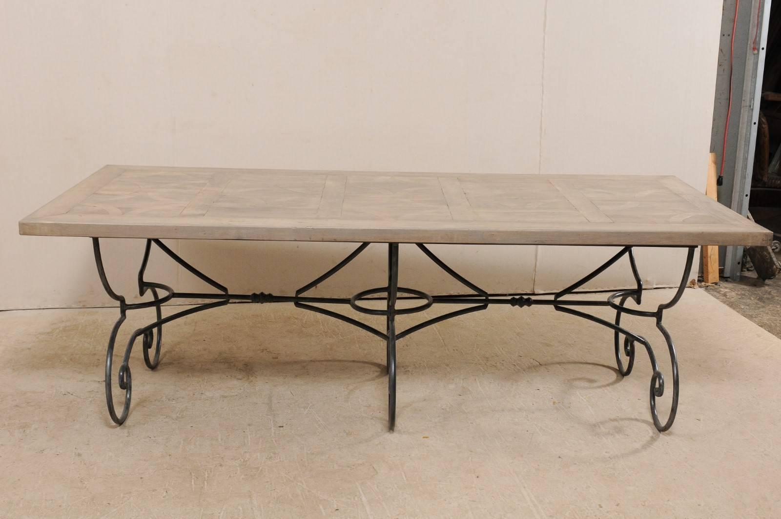 Carved French Vintage Table with Inlay Wood Top on a Beautiful Scrolling Iron Base For Sale