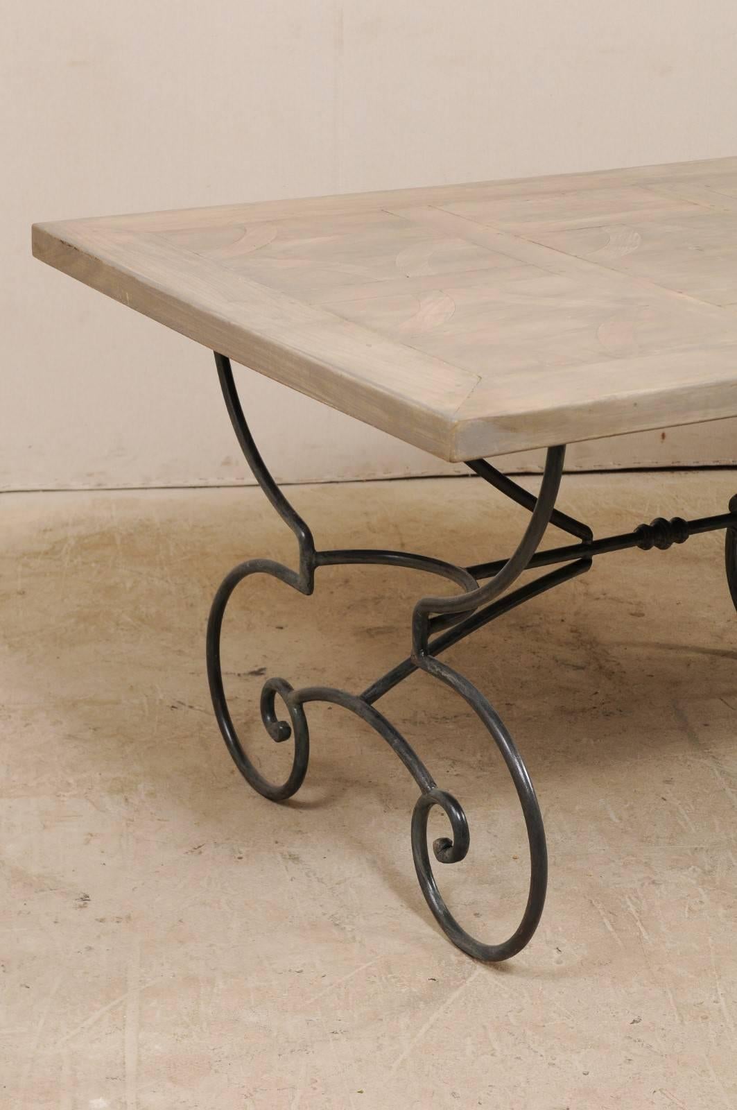 20th Century French Vintage Table with Inlay Wood Top on a Beautiful Scrolling Iron Base For Sale