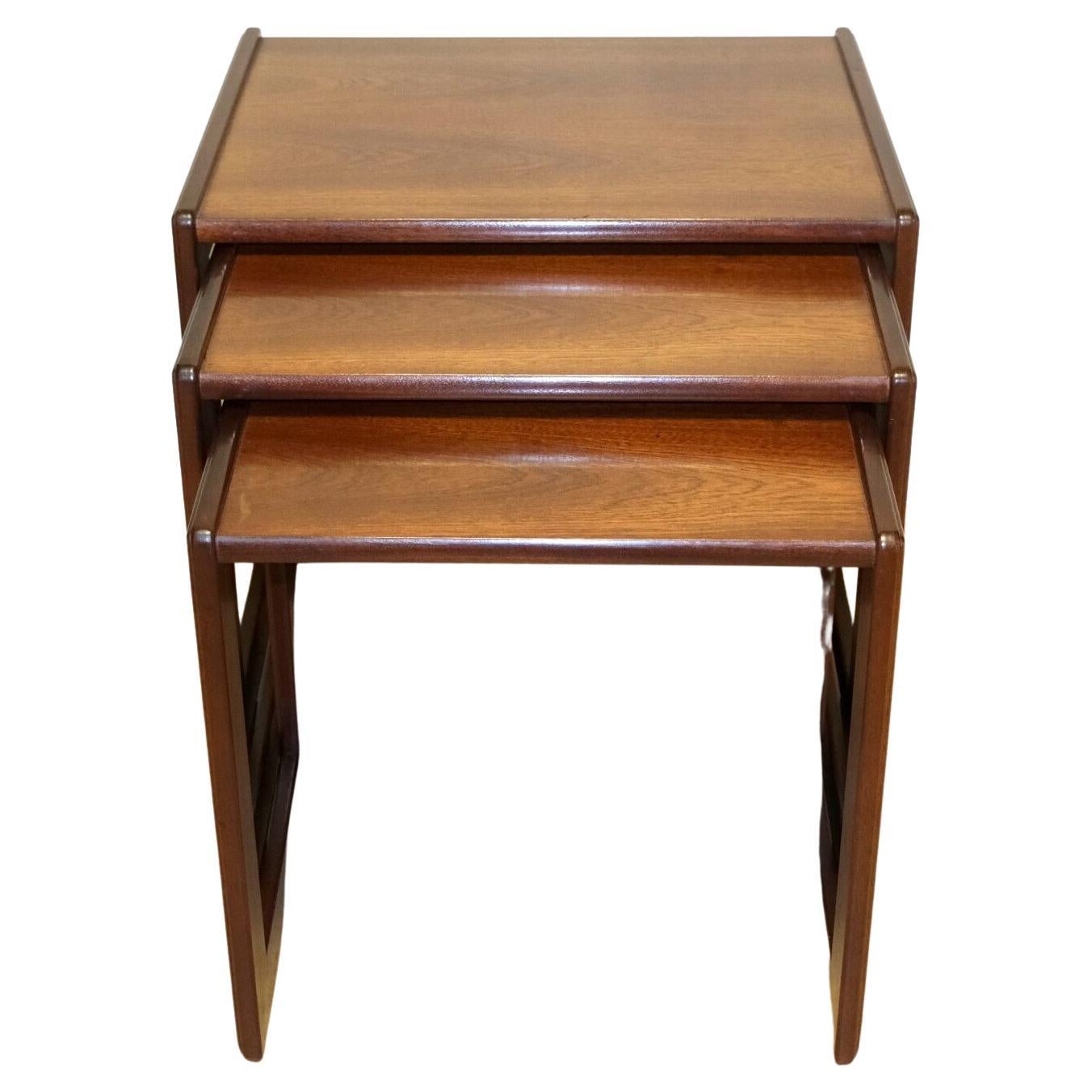 We are delighted to offer for sale this good-looking Art Deco G Plan brown Teak set nest of tables on square support.

This charming and beautiful set offers you elegance and quality. The joints on the legs show the tight minimalist design as G Plan