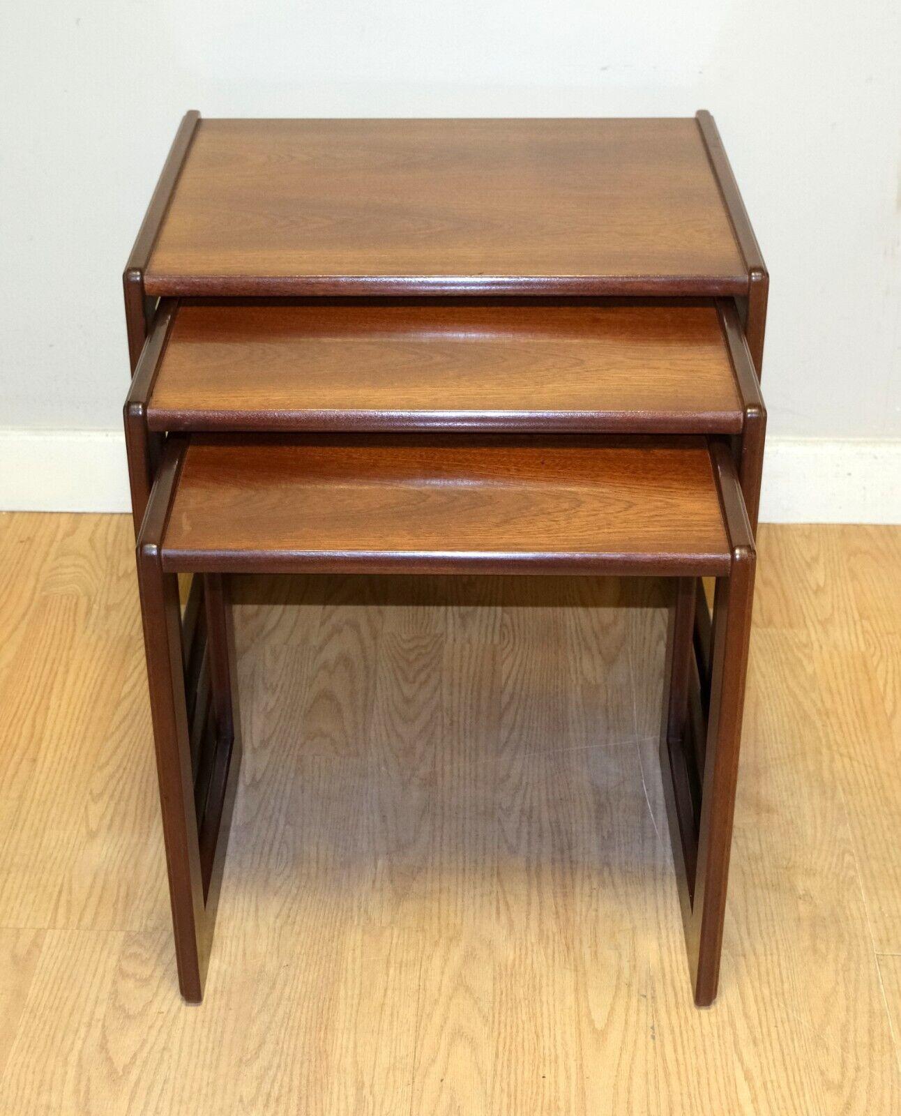 We are delighted to offer for sale this stunning Art Deco, G Plan, teak set nest of three tables on square supports.

This charming and beautiful set offers you elegance and quality. The joints on the legs show the tight minimalist design known as