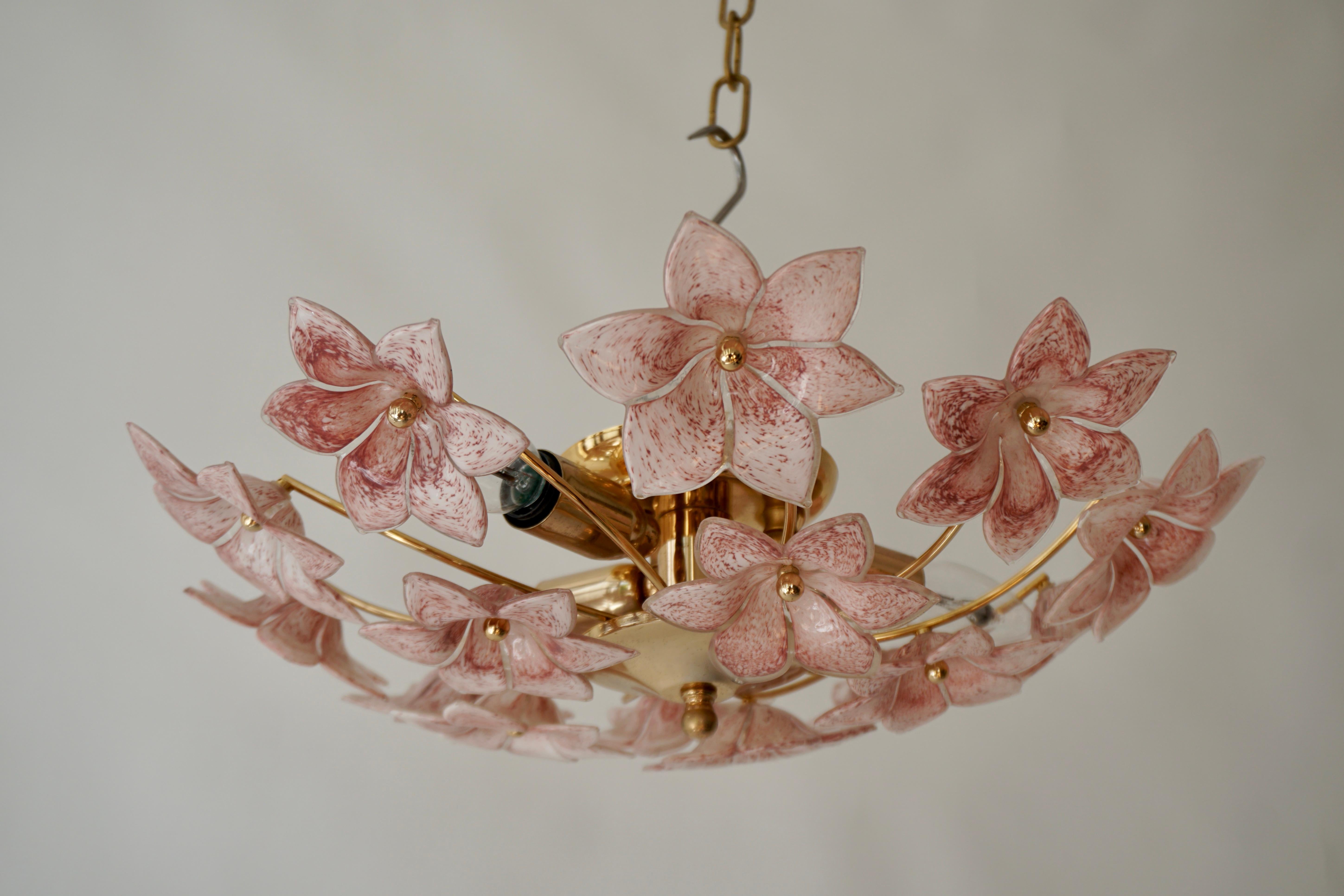 Two lovely pink Murano glass flowers flush mount or sconces, Italy, 1970s. 

Brass ceiling basket with hand-blown pink Murano glass flowers.This flush mount can also be used as a wall lamp.
It takes three E14 screw light bulbs. 

Measures: Diameter