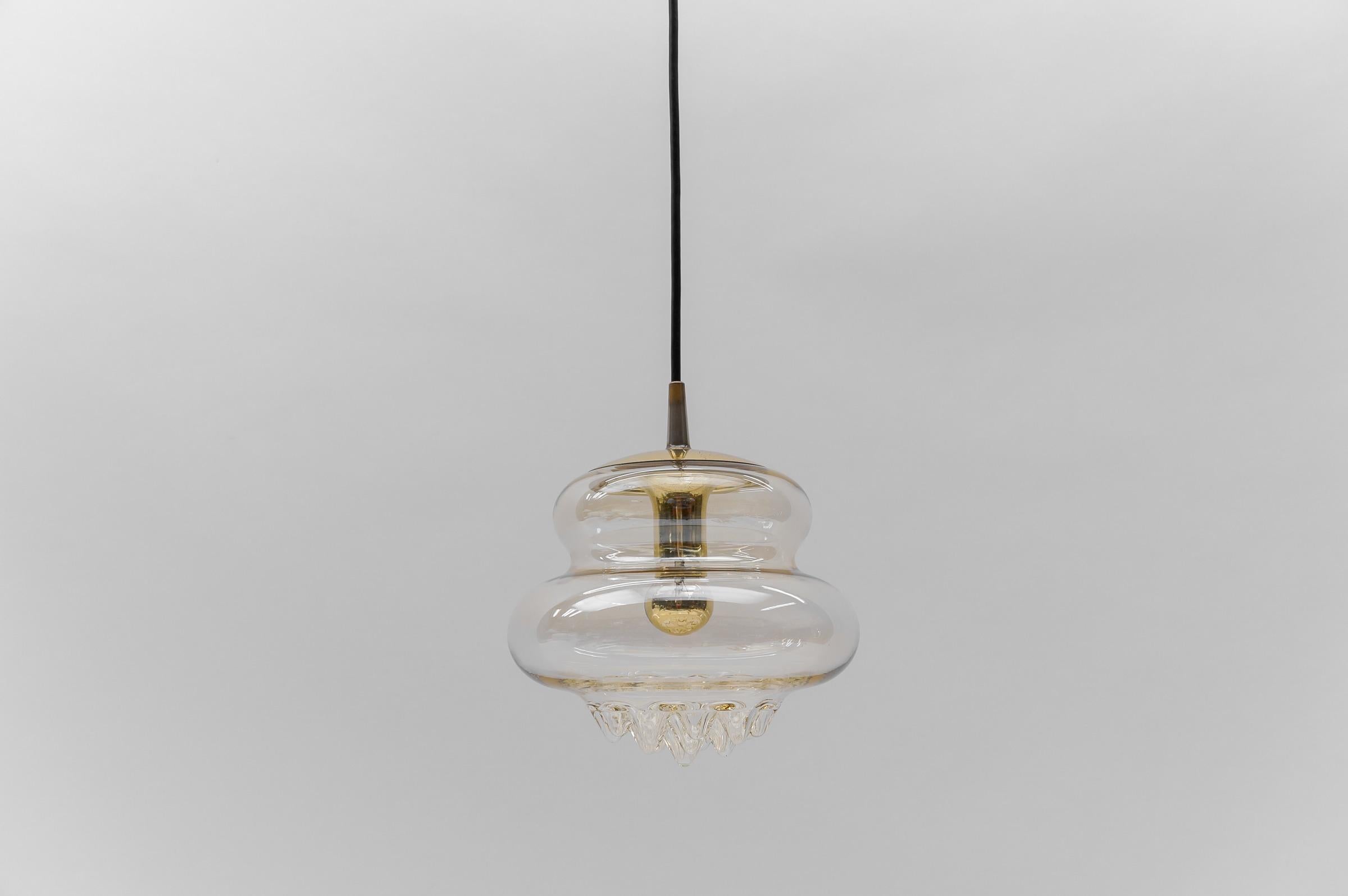 Lovely Glass Drops Ceiling Lamp by Peill & Putzler, 1970s

The lamp need 1x E27 / E26 Edison screw fit bulb, is wired, in working condition and runs both on 110 / 230 volt.

Light bulbs are not included.

It is possible to install this fixture in
