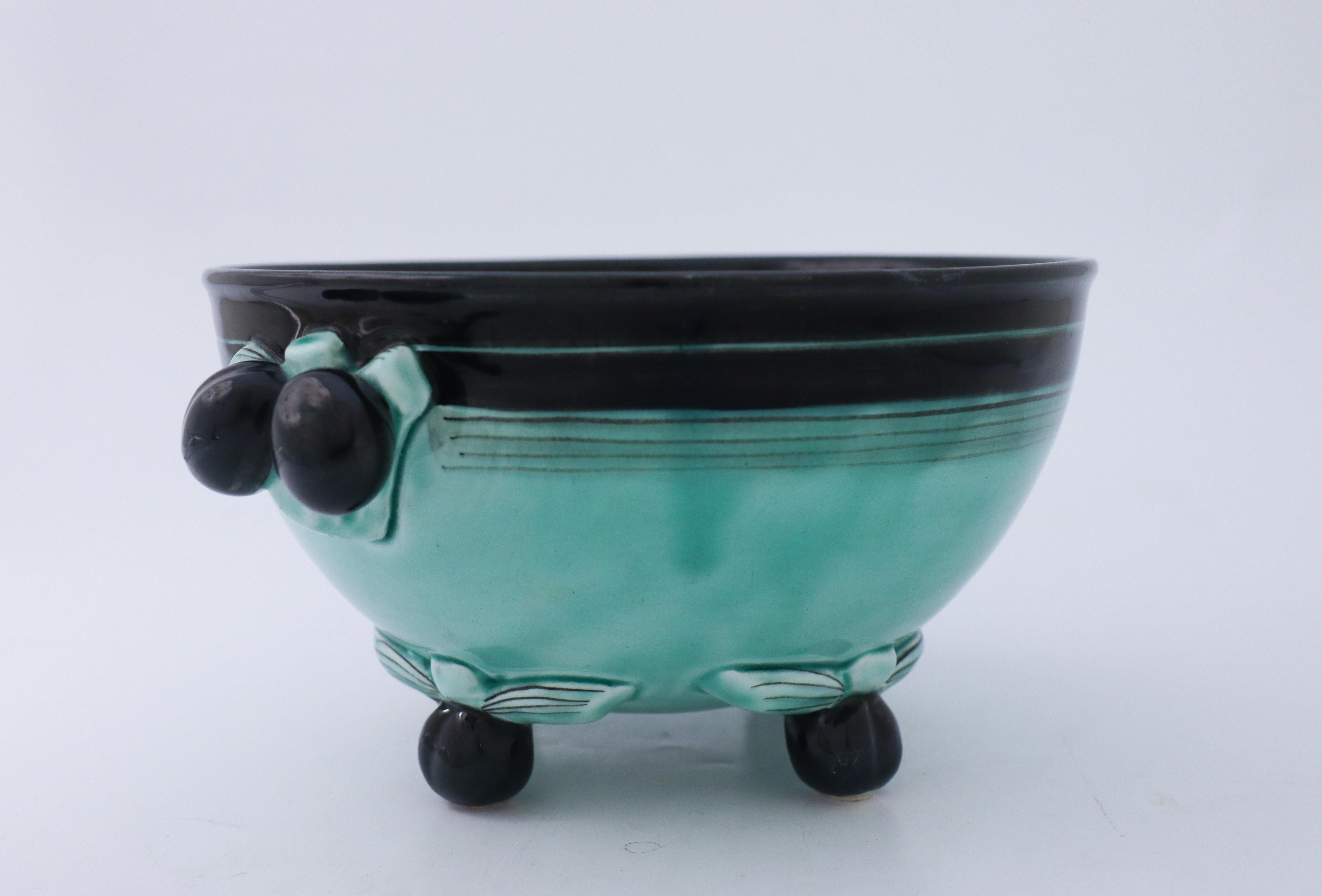 A lovely bowl designed by Ilse Claesson in the 1930s at Rörstrand, Sweden. It is 23,5 cm in diameter and about 11,5 cm high and in very good condition except from some craquelure in the glaze because of the age. This is an iconic Art Deco bowl.