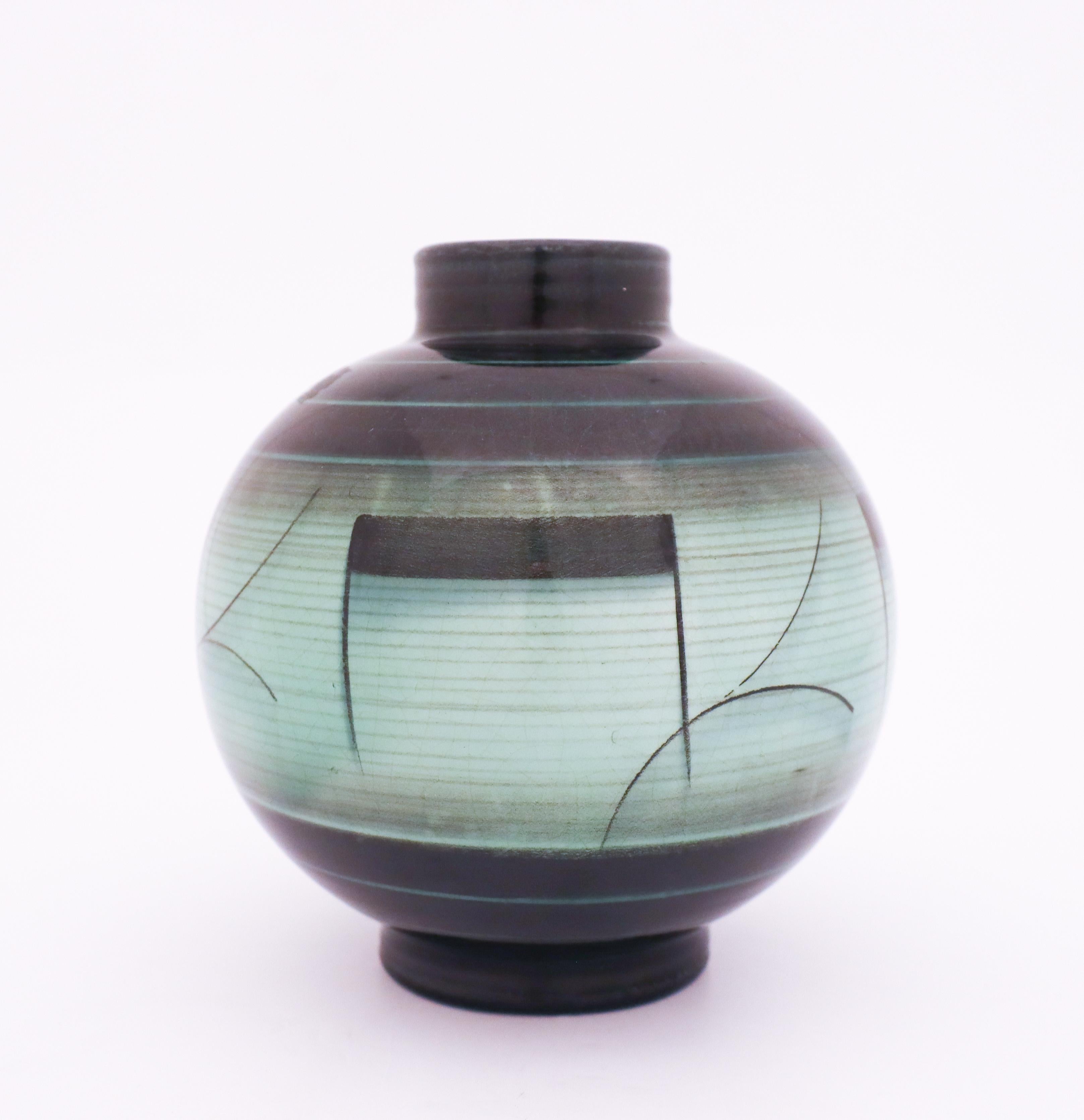A lovely vase designed by Ilse Claesson in the 1930s at Rörstrand, Sweden. It is 16 cm high and in very good condition except from some craquelure in the glaze because of the age.