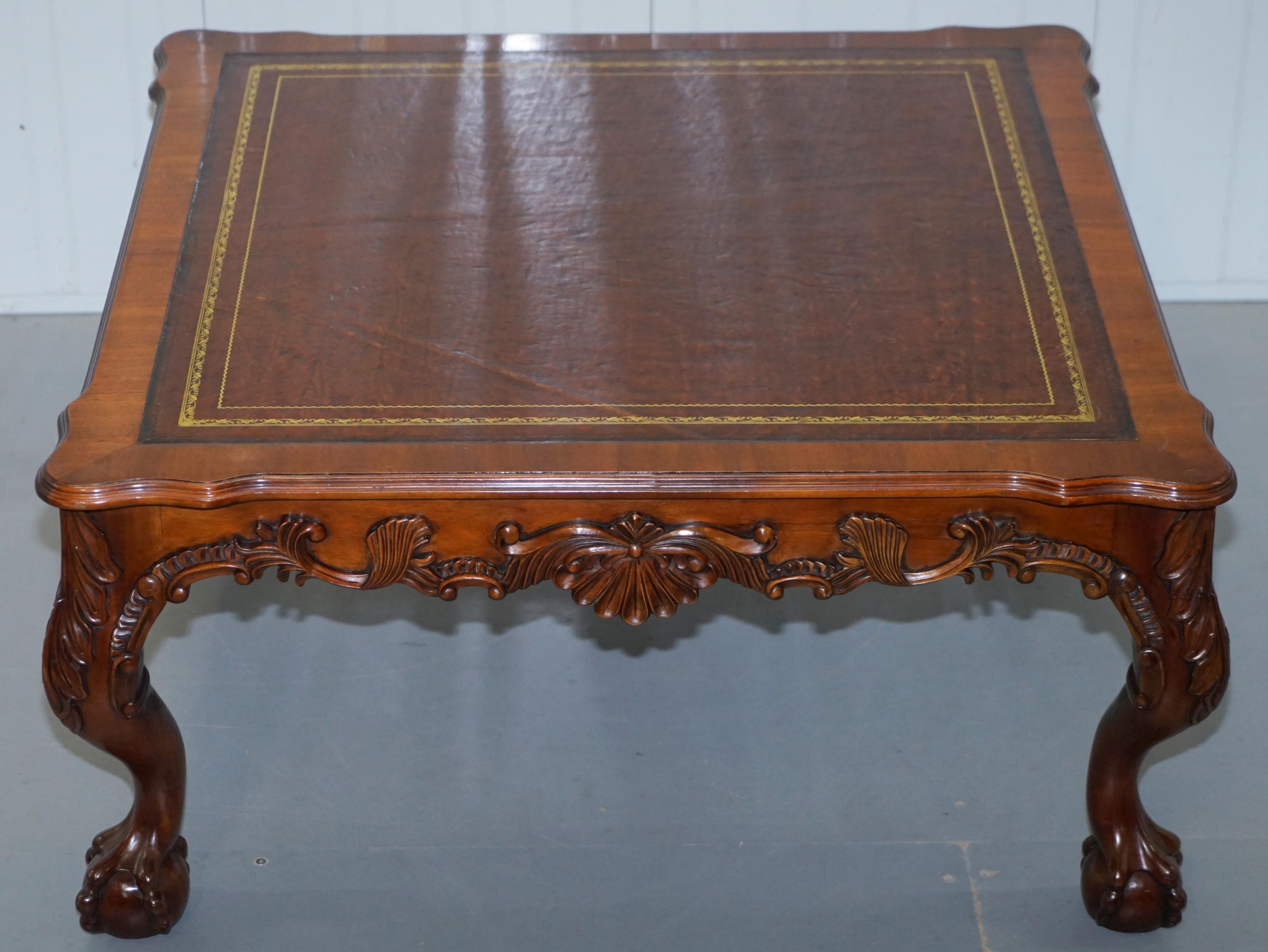 We are delighted to offer for sale this stunning hand-carved Claw & Ball foot on cabriolet legs coffee table with brown leather top

This table is made from solid mahogany and is ornately carved all over in the Thomas Chippendale style. The