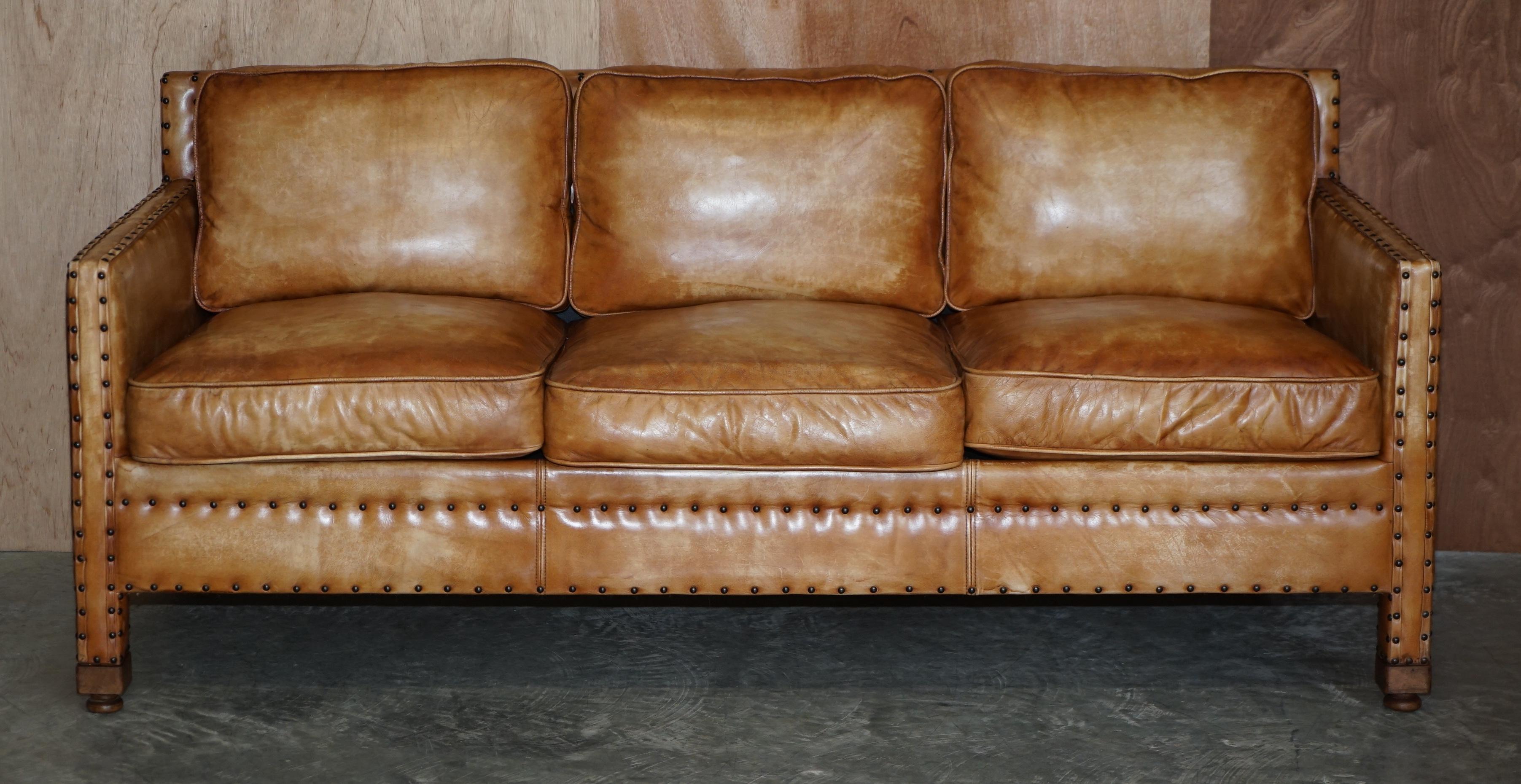 We are delighted to offer for sale this lovely hand dyed tan brown leather three seat sofa with ornate stud work all over

The sofa is well made and stylish, the leather is fully aniline cattle hide so it has a thick natural look, its then hand