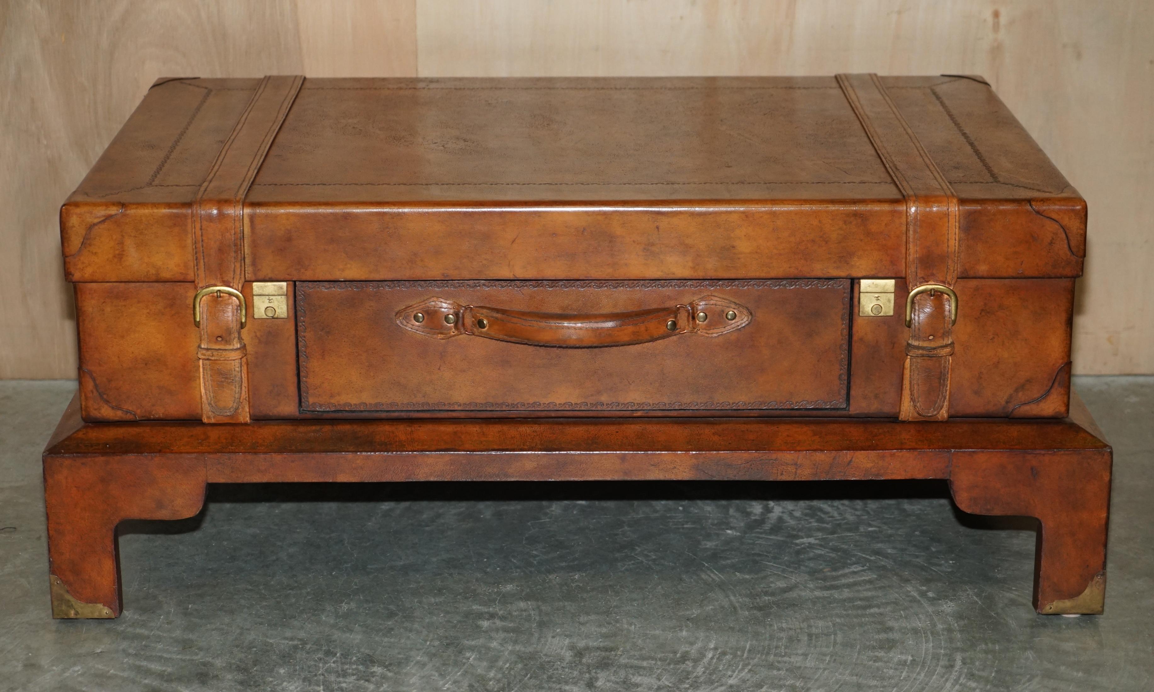 We are delighted to offer for sale this absolutely stunning, hand dyed saddle brown leather trunk / suitcase coffee table with one drawer

A very well made, decorative and unitarian piece, designed to be used as a coffee table, it looks stylish