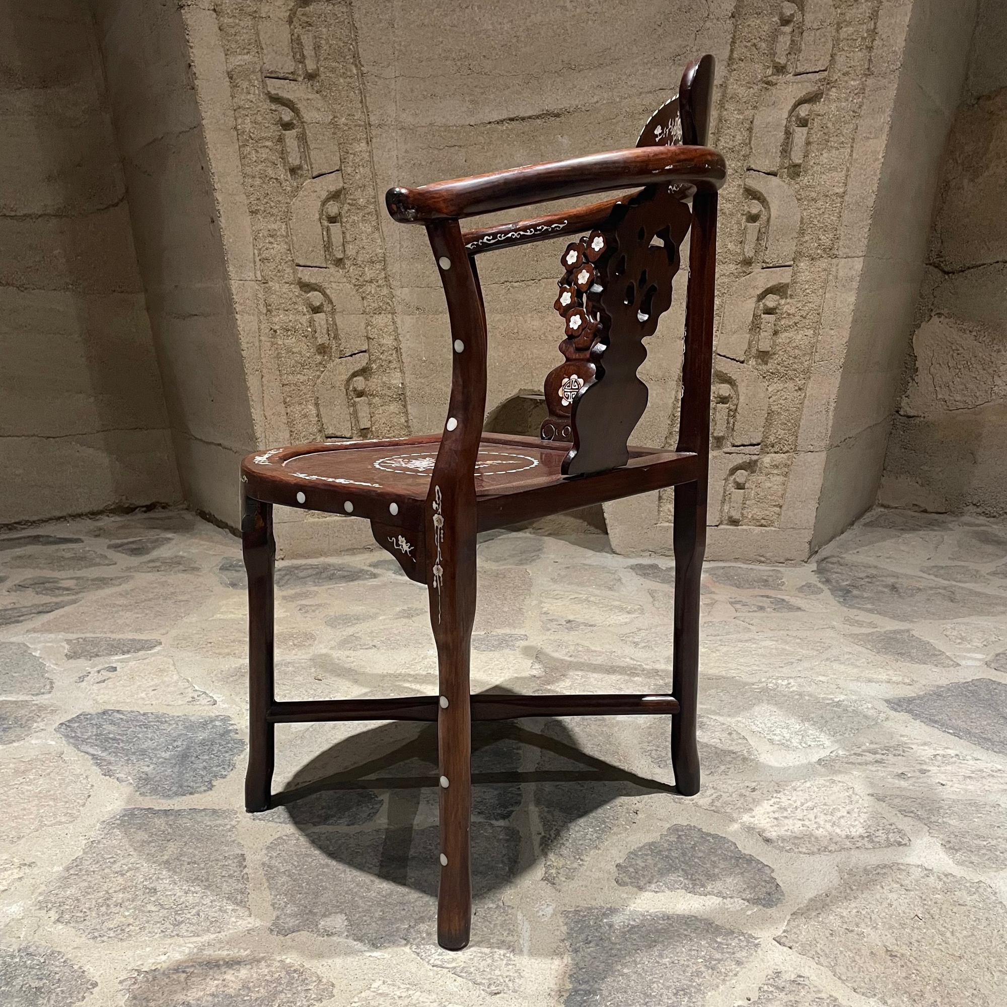 Side chair
Chinese solid rosewood corner angle side armchair with carved mother of pearl ornamentation inlay.
No label.
32.75 x 27 w 21 d Seat h 16.5 inches
Original Unrestored Preowned Condition. Light stain on top seat. Sun faded. Presents firm