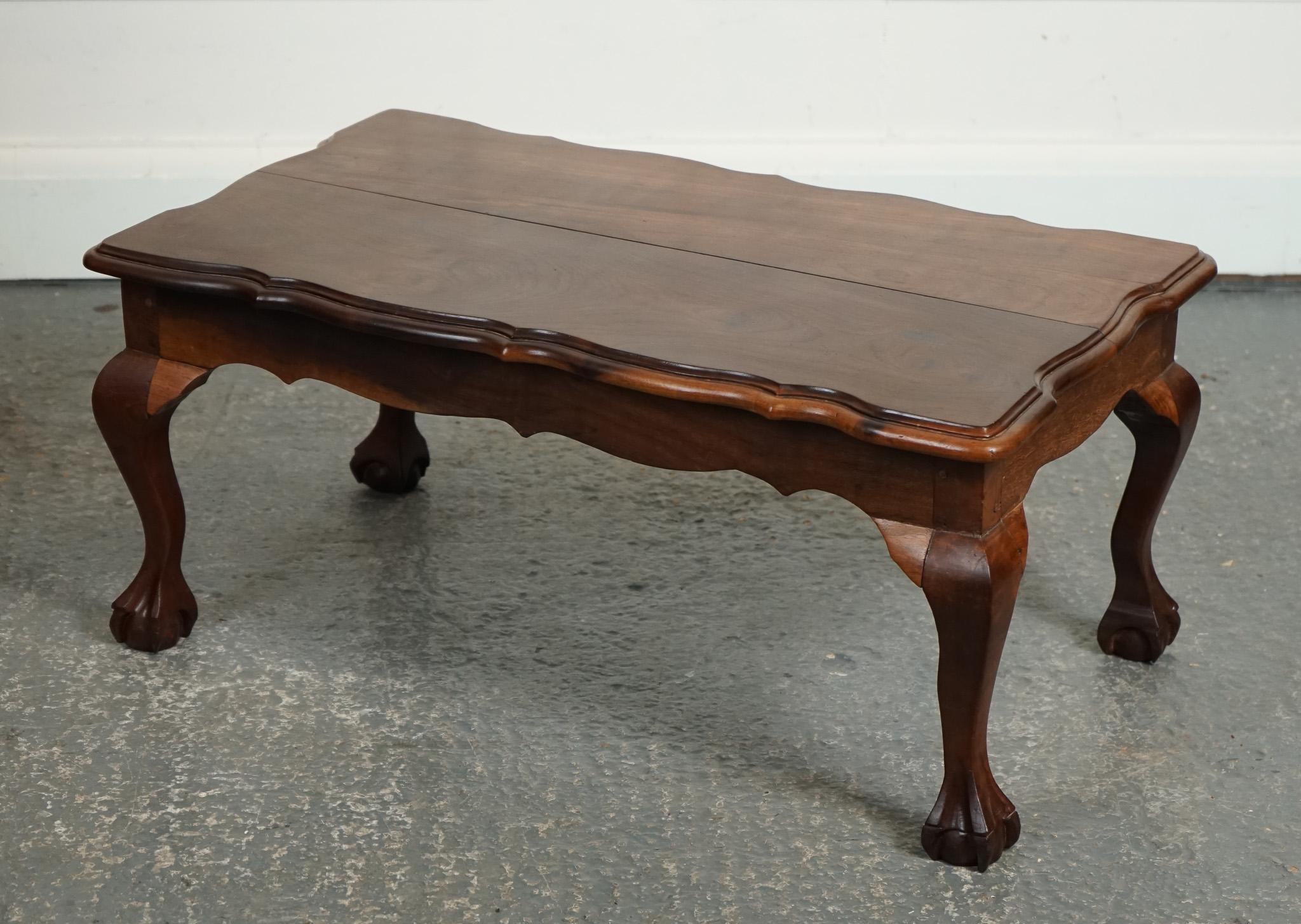 

We are delighted to offer for sale this Lovely Hardwood Coffee Table.

 On claw and ball feet is a true embodiment of timeless elegance and sophistication. Crafted from high-quality hardwood, this exquisite piece of furniture showcases a rich