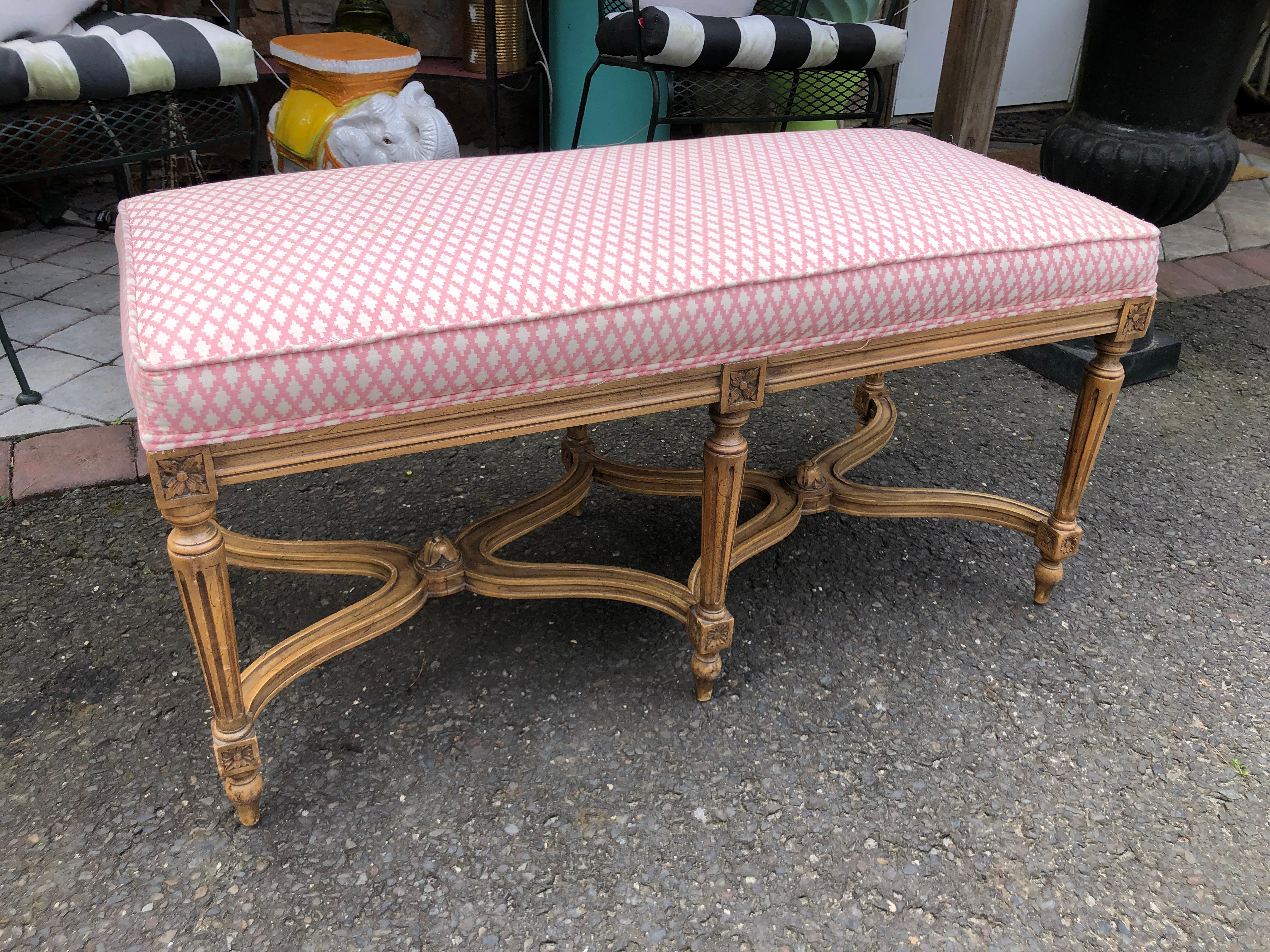 Lovely Hollywood Regency Dorothy Draper style carved wood bench.  Well crafted carved fruitwood base with custom upholstered top, this piece measures 19