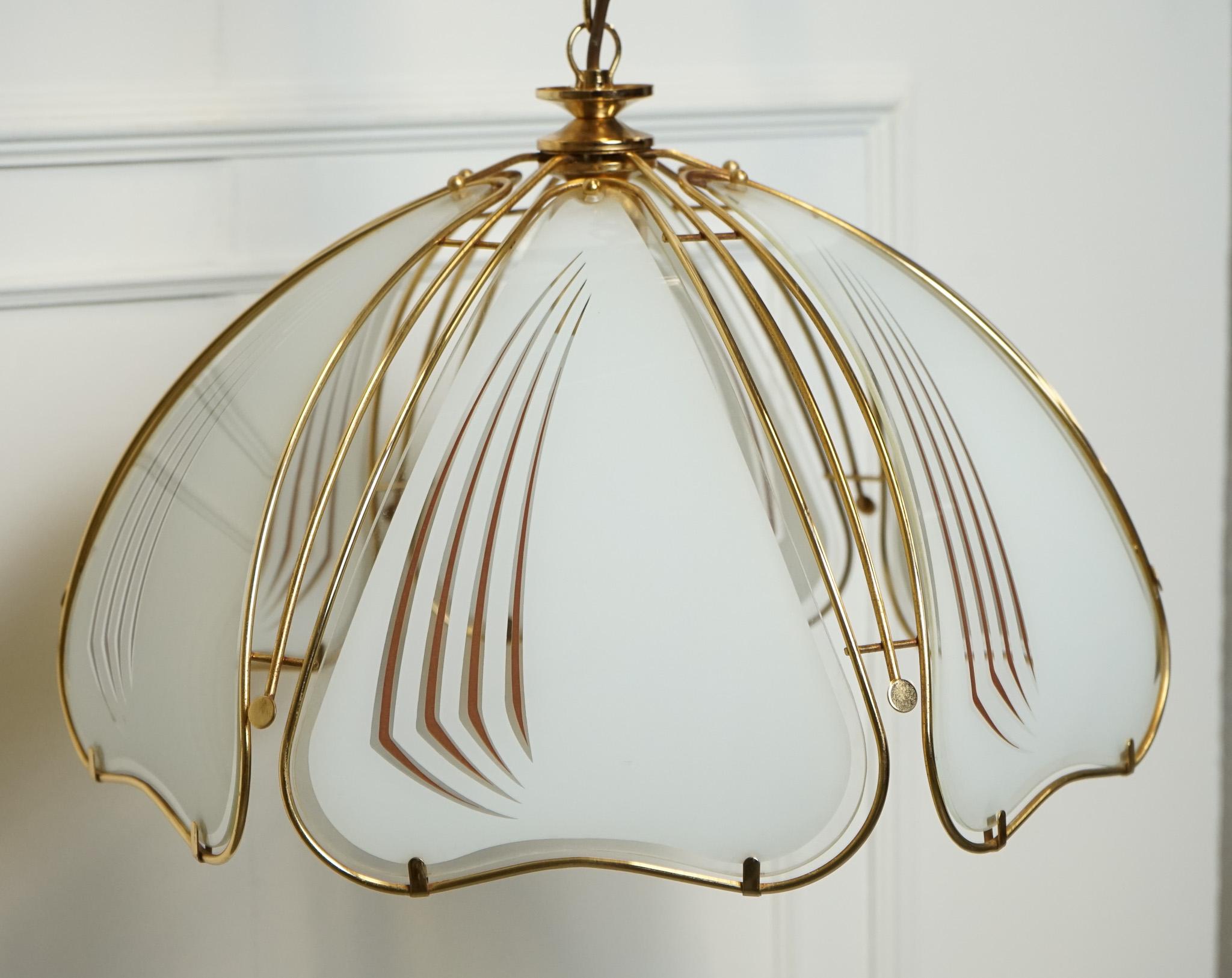 
We are delighted to offer for sale this Art Deco Style Italian Glass Chandelier.

An Art Deco style Italian chandelier features a striking design with glass elements that give it a luxurious and elegant aesthetic. 

The chandelier is adorned with