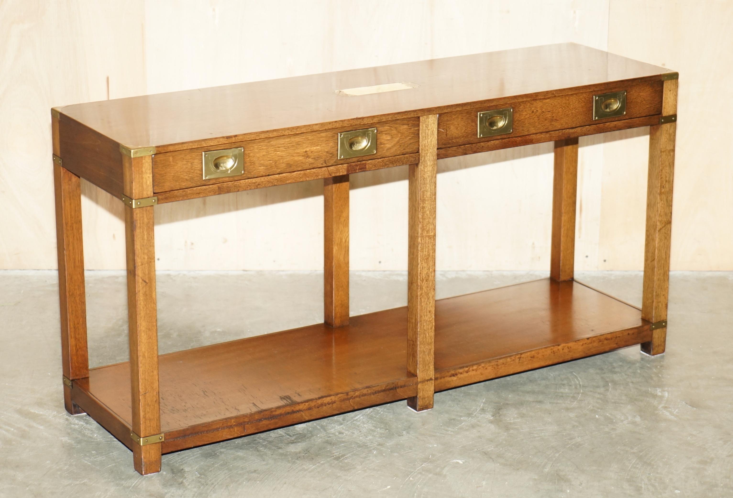 Royal House Antiques

Royal House Antiques is delighted to offer for sale this lovely vintage circa REH Kennedy, Harrods London retailed, Military Campaign three drawer console table / sideboard 

Please note the delivery fee listed is just a guide,