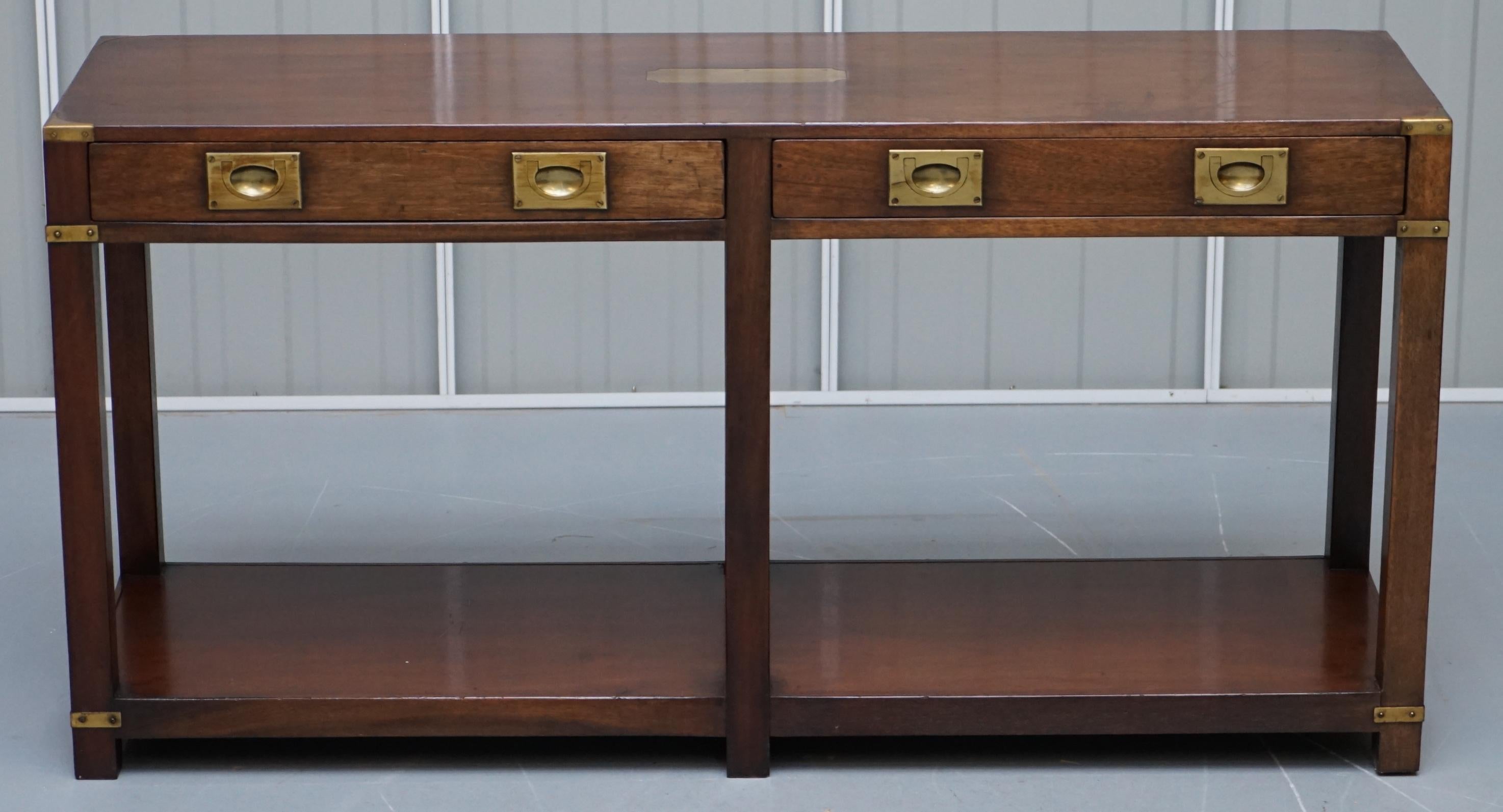 We are delighted to offer for sale this lovely Military Campaign Harrods Kennedy style console table with drawers

A good looking and well made table, in solid hardwood with brass hard wear

The table has been cleaned waxed and polished, there