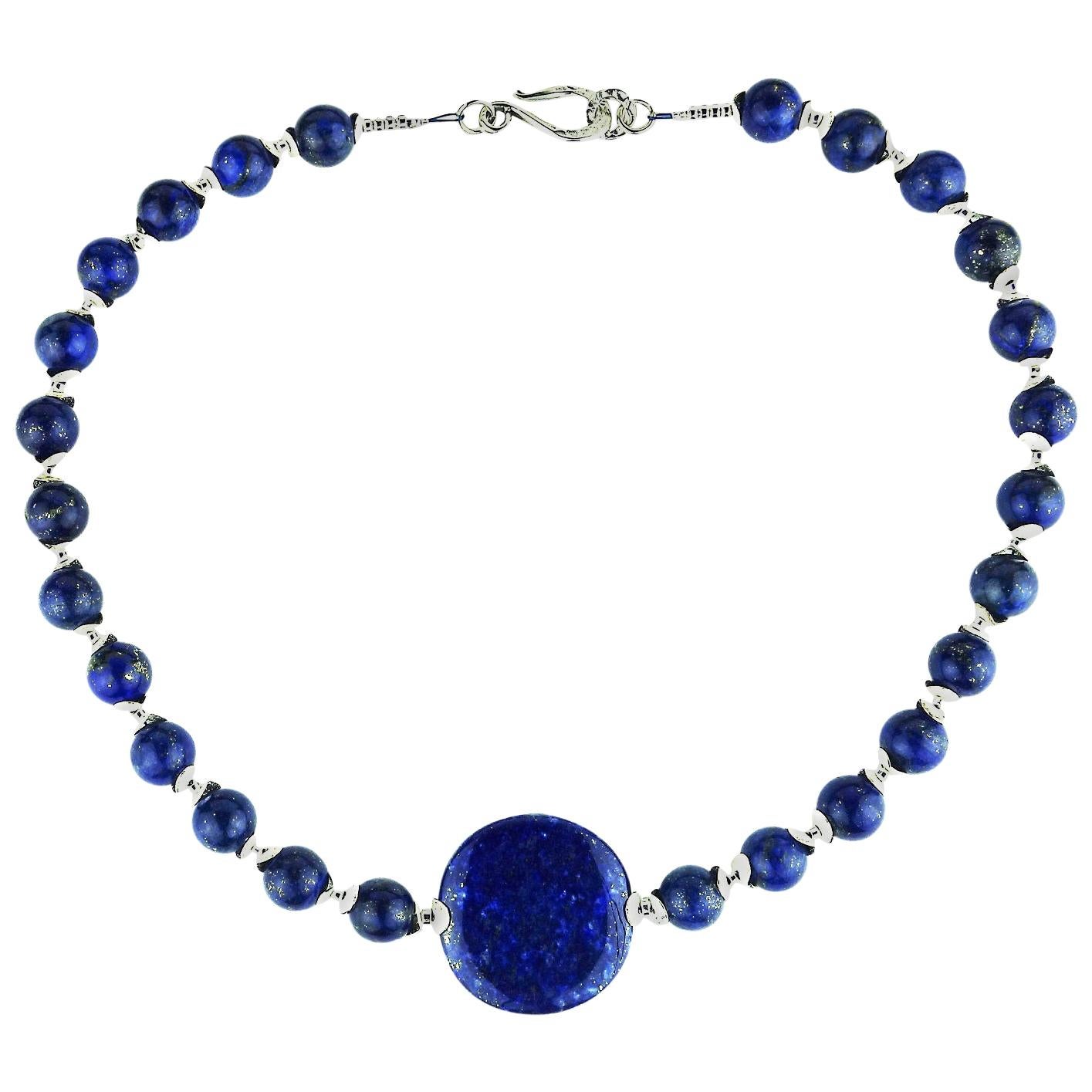 Beautiful 12 MM blue Lapis Lazuli beads with a Lapis Lazuli disc focal of 35 MM necklace. This is a lovely Blue, blue necklace with lots of silver accents including a Sterling Silver hook style clasp. 20 inches in length. 

