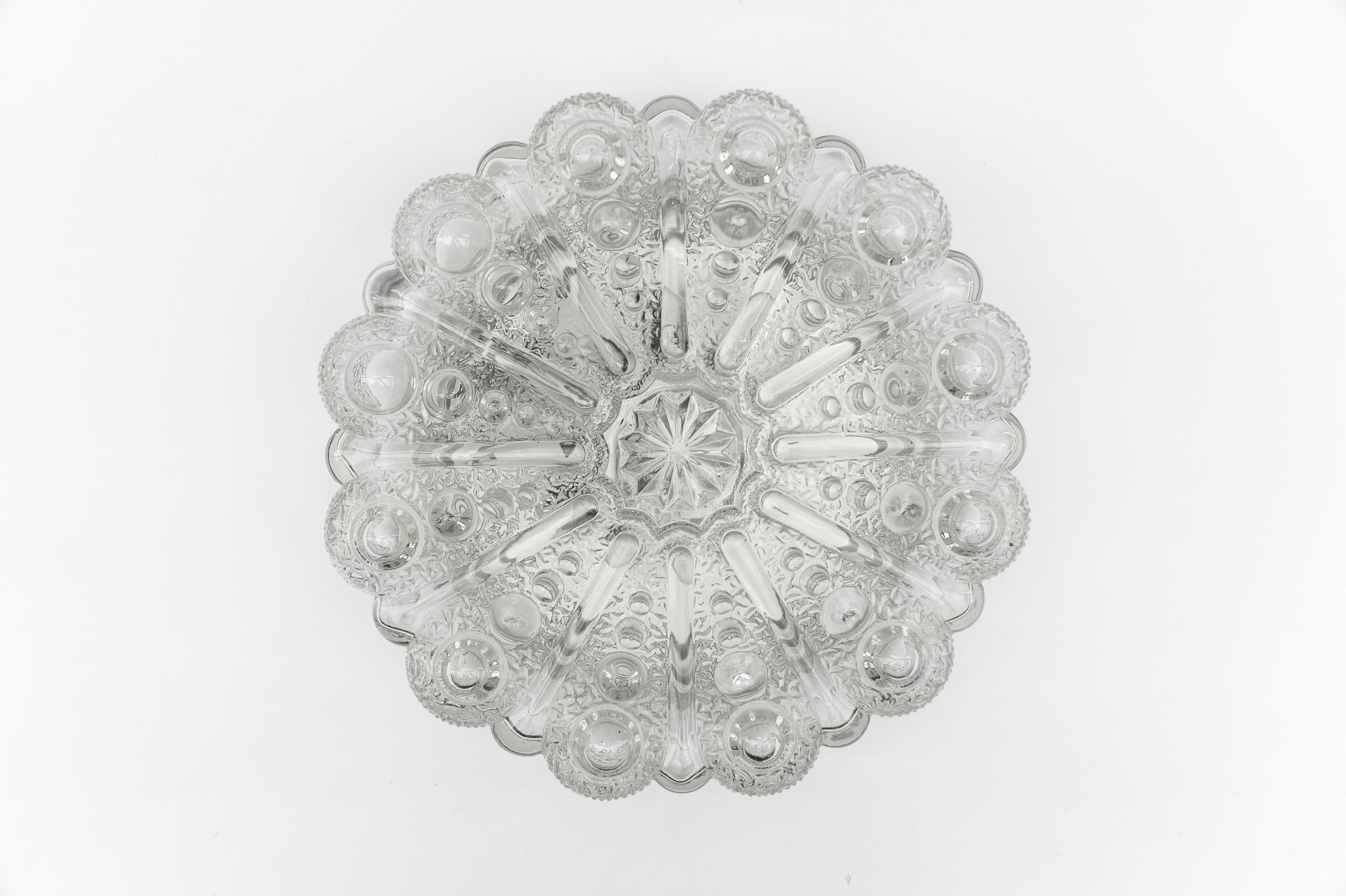 Lovely Large Bubble Glass Wall Lamp or Flush Mount Light, 1960s Germany

The lamp requires 1x E27 / E26 Edison screw bulb, is wired, functional and runs on both 110 / 230 volts.

Bulbs are not included.

It is possible to install this device in all