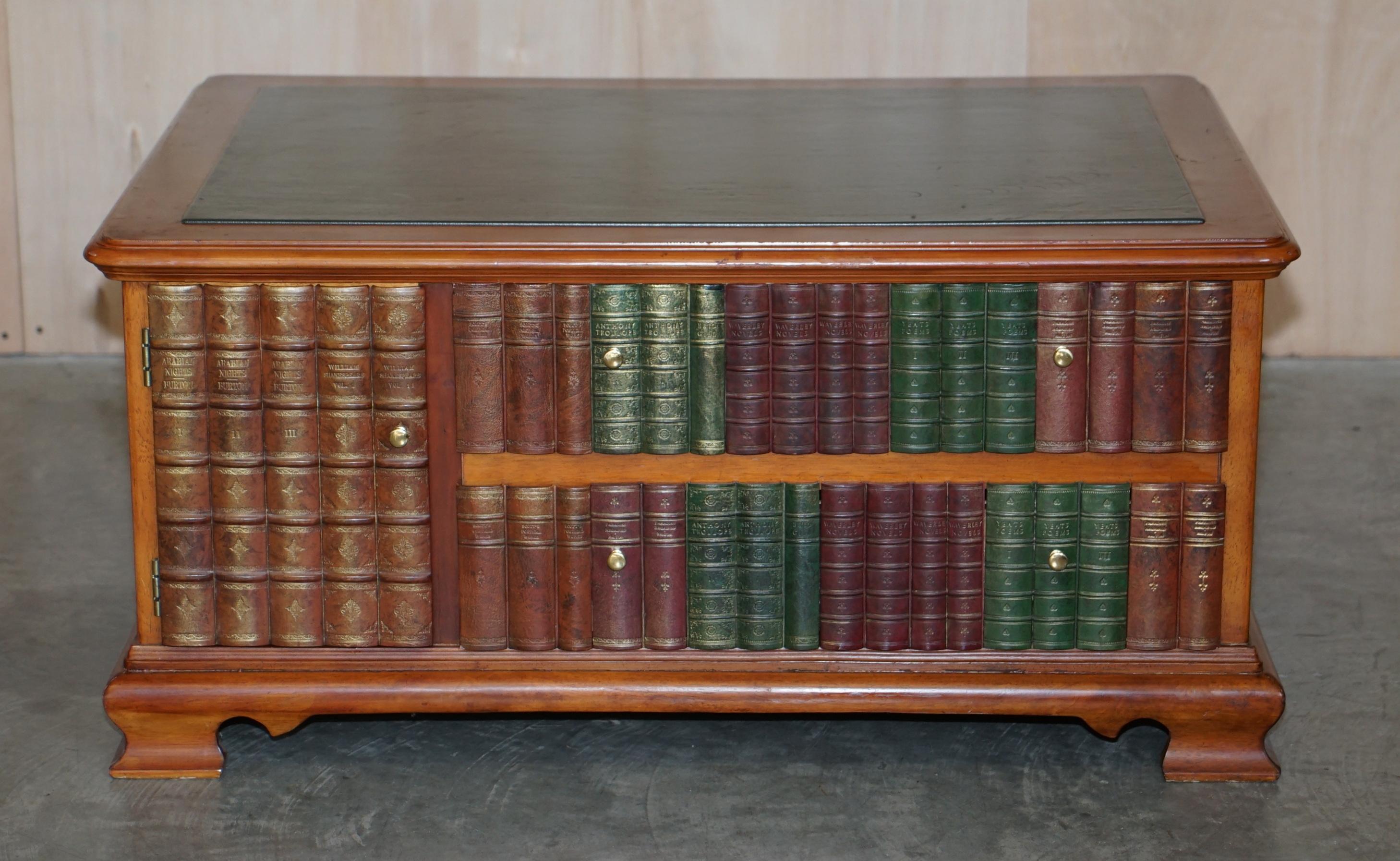 We are is delighted to offer for sale this very decorative, faux book fronted, Scholars library coffee table 

A very good looking and expertly crafted piece, it has a small cupboard and twin drawers to the front with a large cupboard to the rear