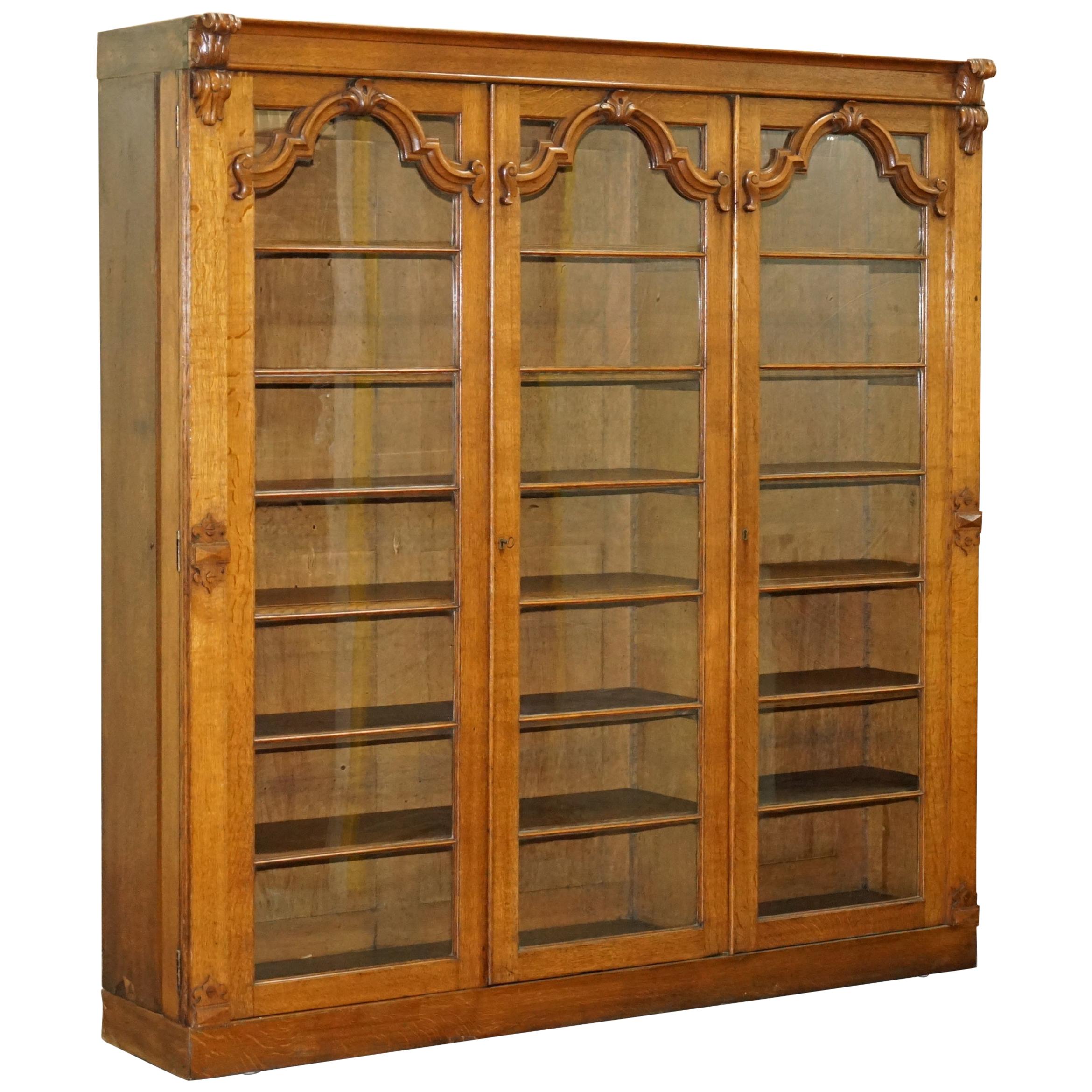 Ornately Carved Oak Bookcase with Leaded Glass Doors at 1stdibs