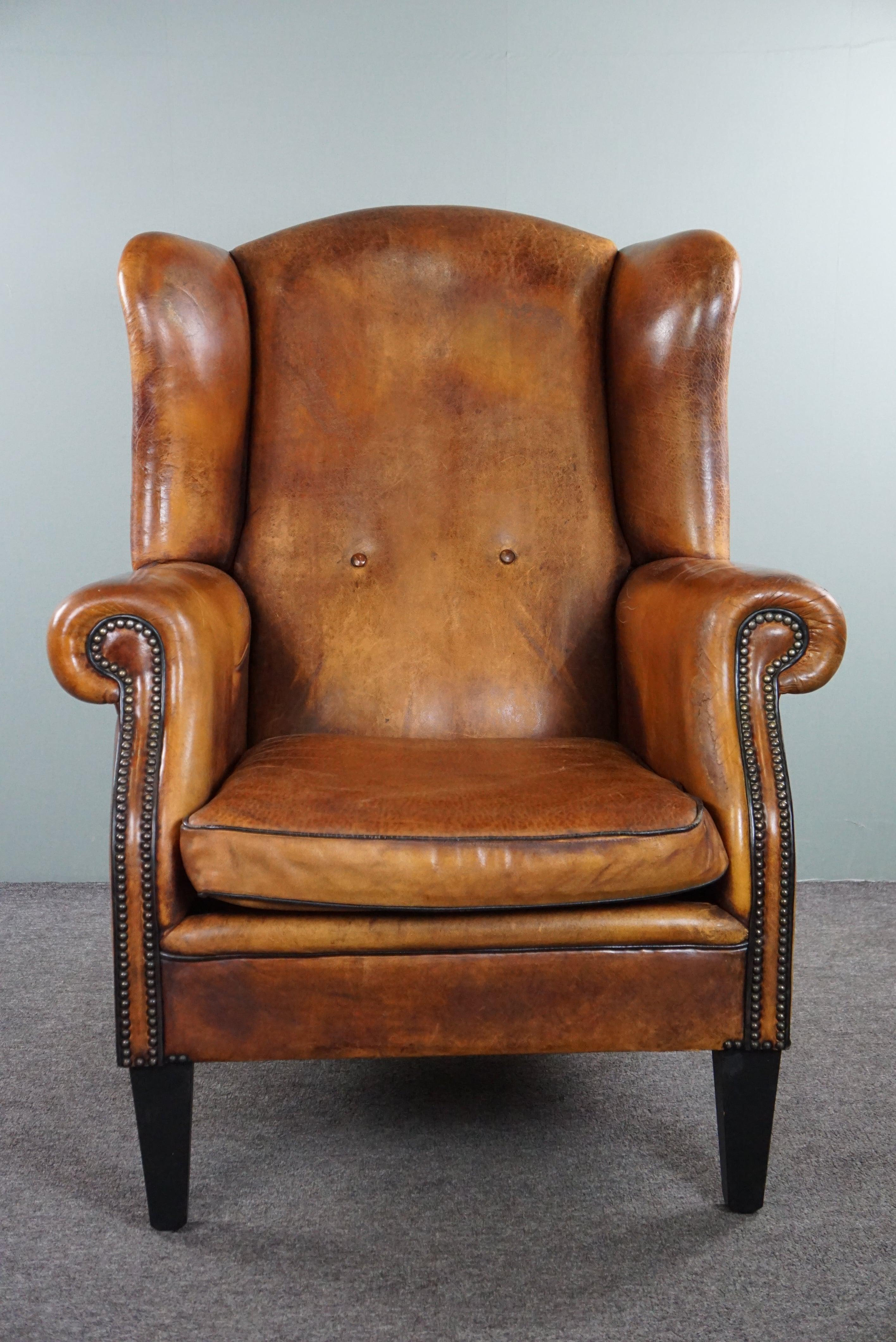 Offered is this lovely large and charming sheepskin leather wingback armchair with very good seating comfort. If you are looking for a wingback armchair, you are probably searching for a beautiful charming chair with gorgeous leather that is also