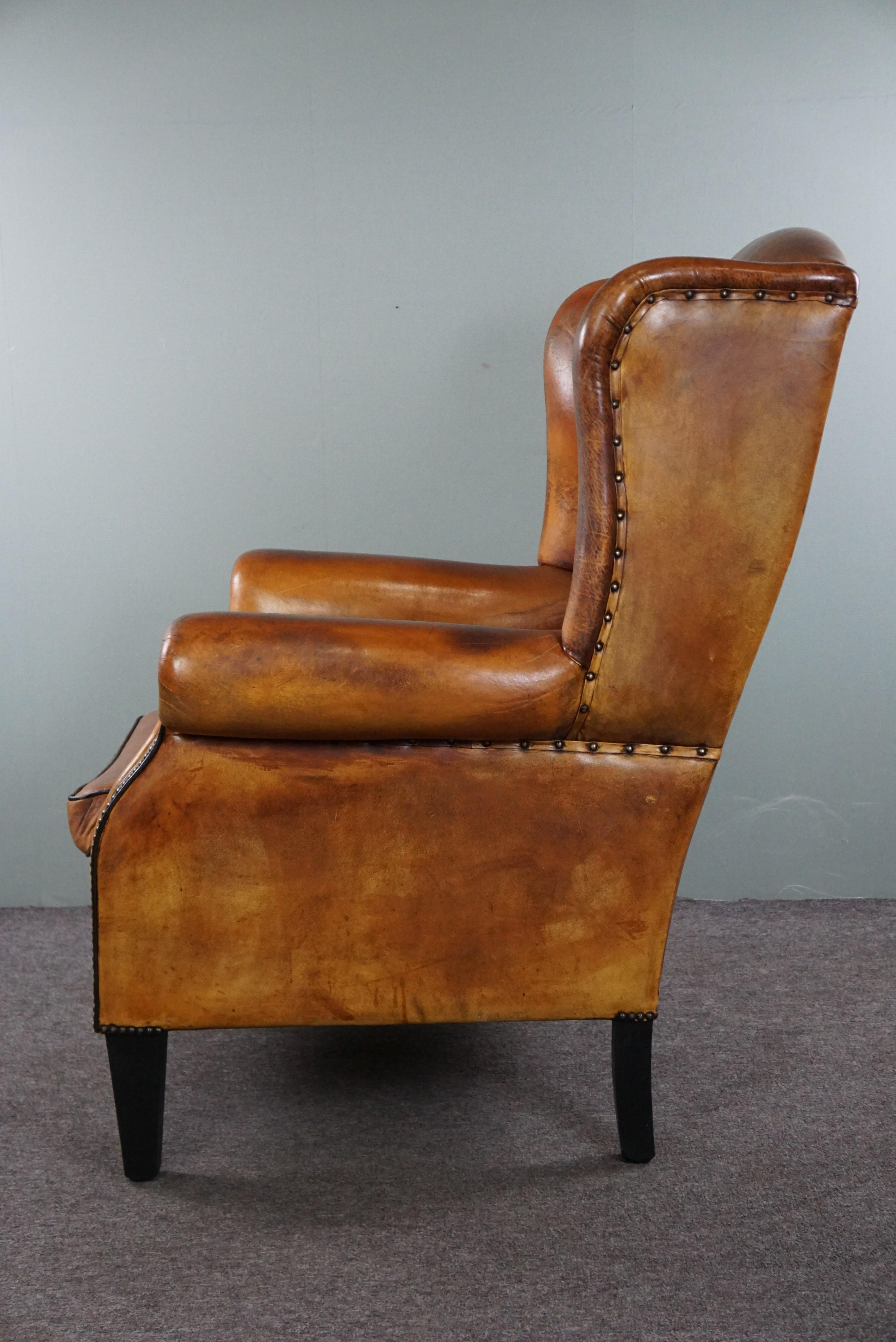 Late 20th Century Lovely large sheepskin leather wingback armchair with very good seating comfort For Sale